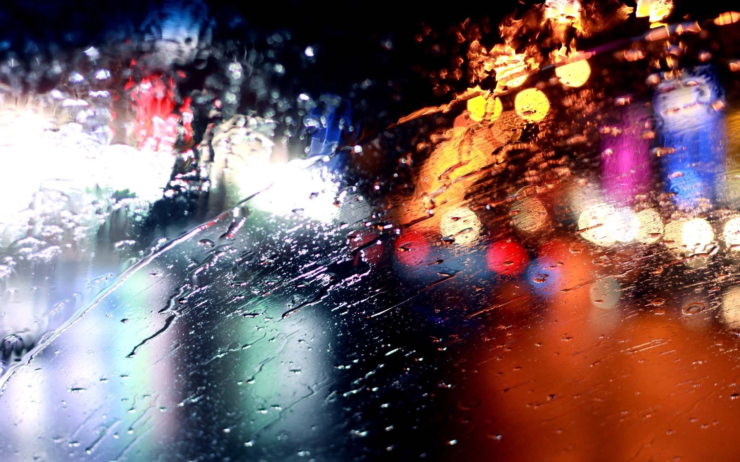 Rain on glass with bokeh city lights HD Wallpaper