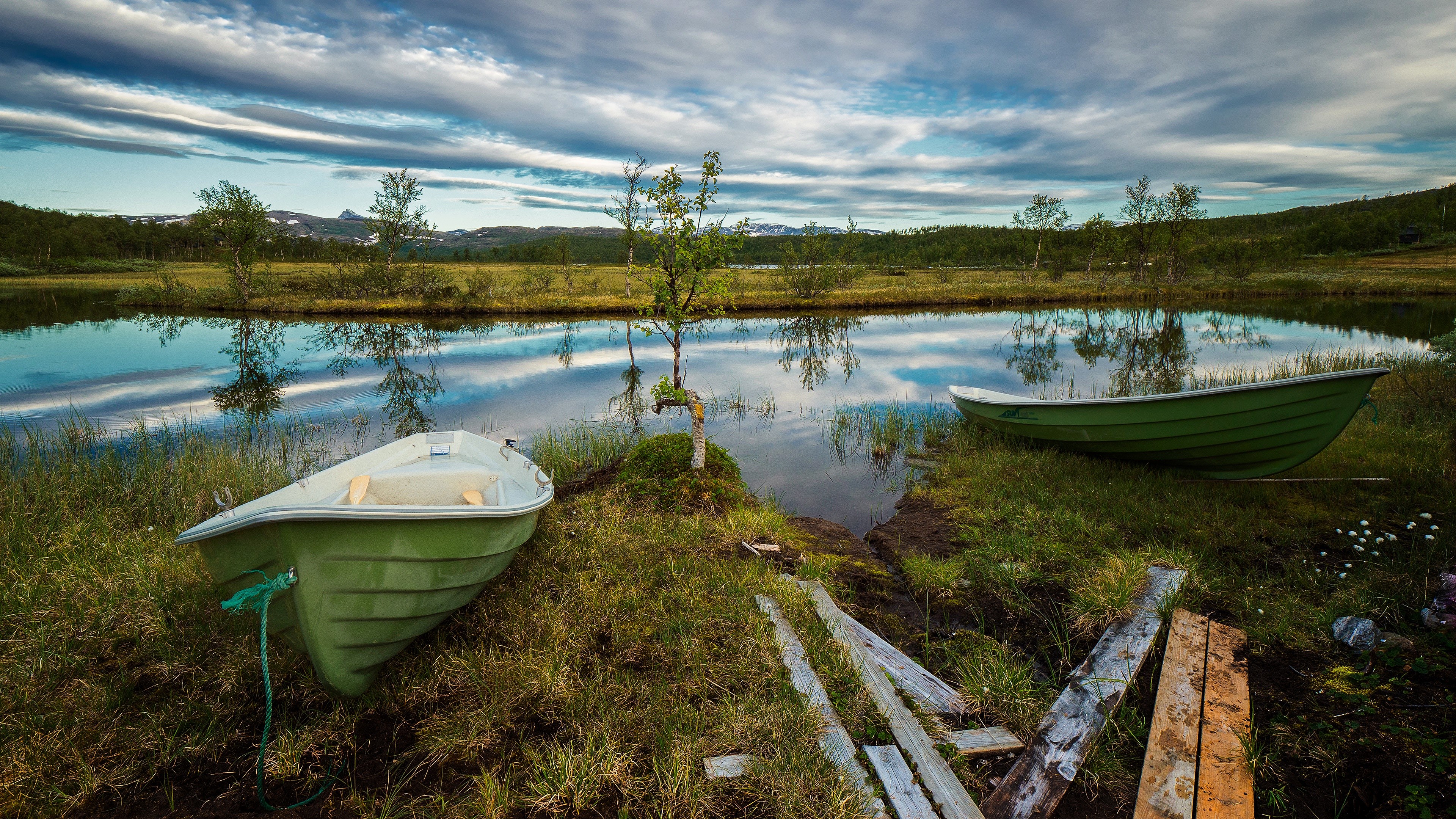 Boats on a lake with reflections HD Wallpaper