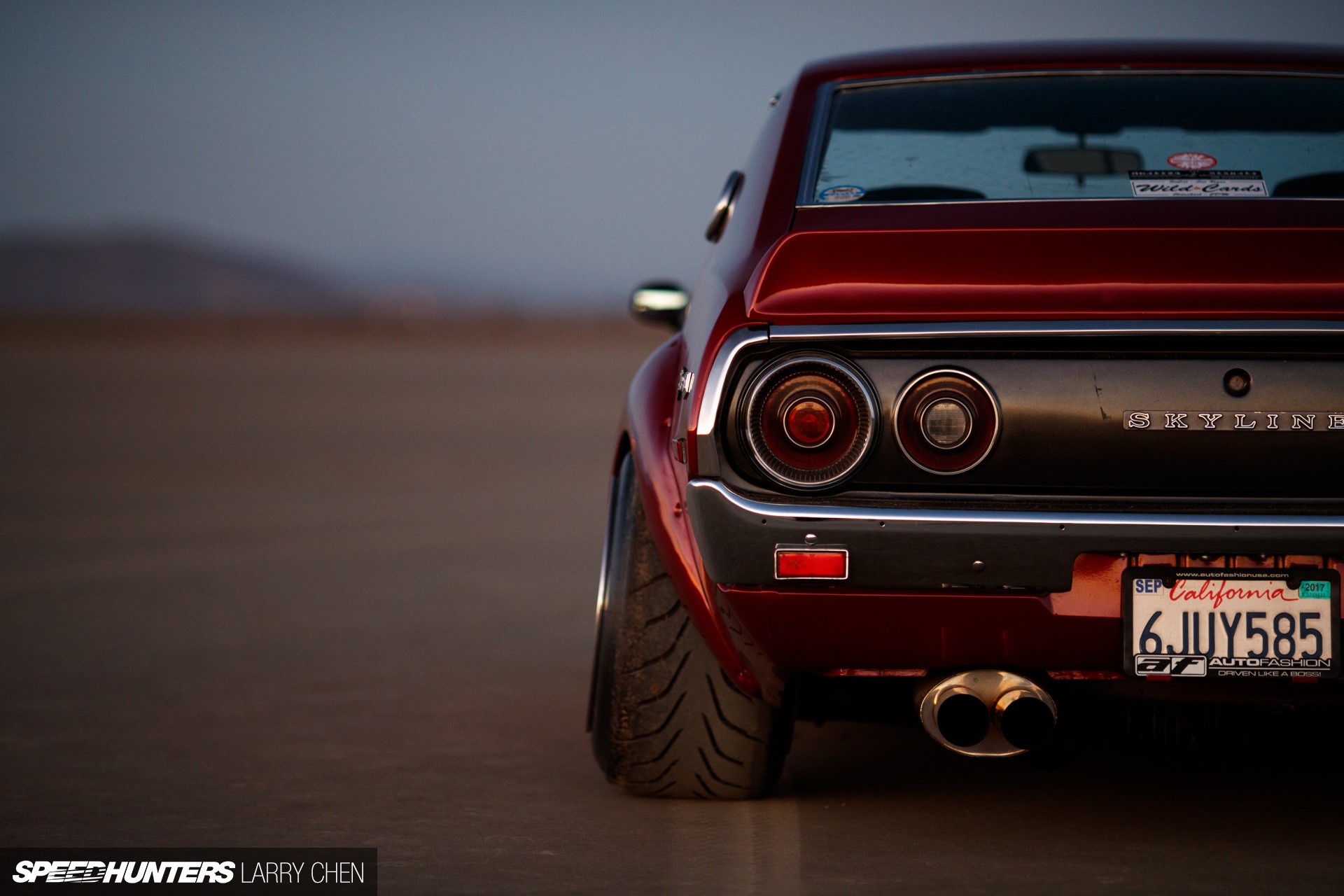 Red Nissan Skyline with California License Plate HD Wallpaper