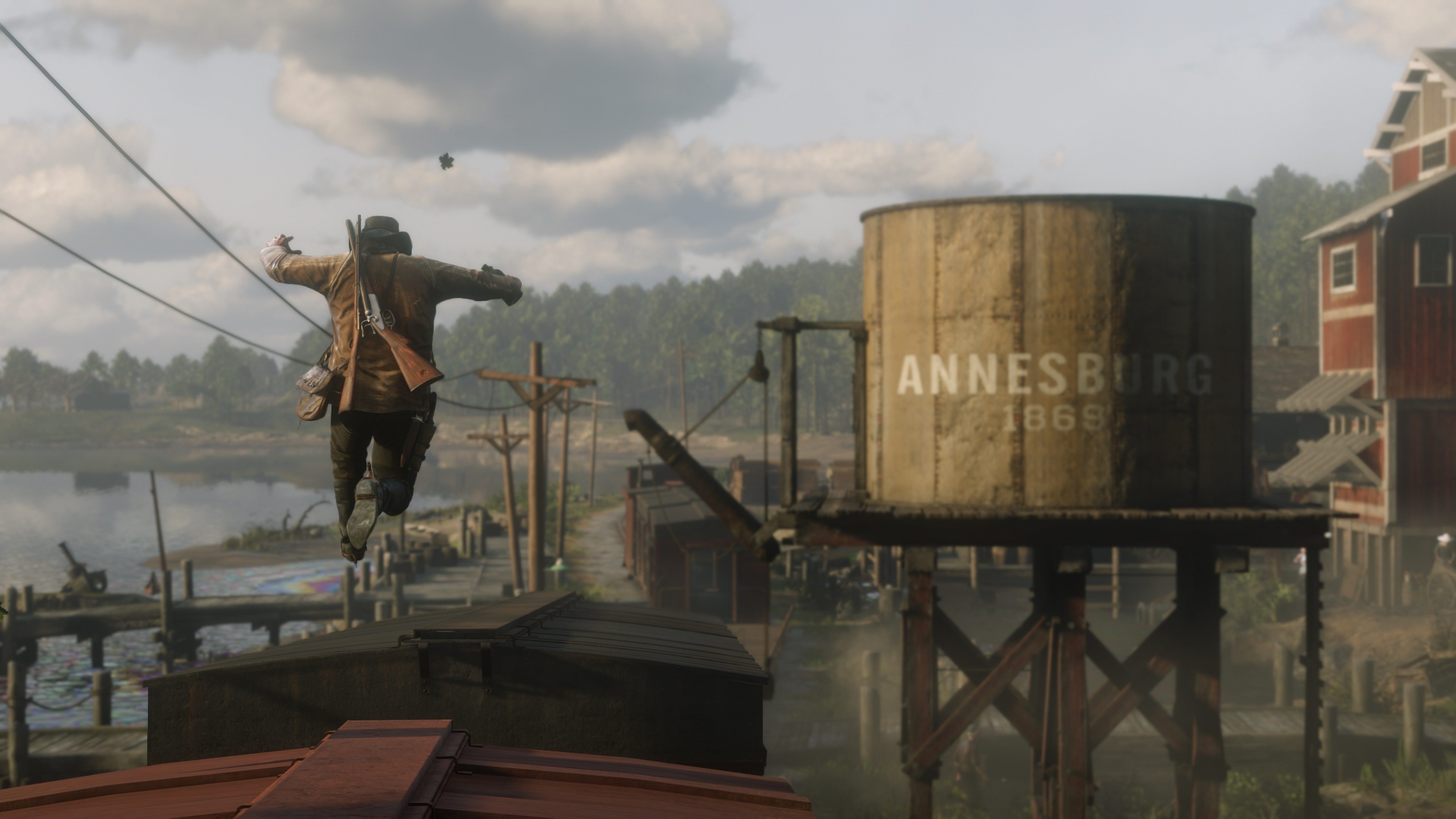 Man jumping near Annesburg water tower in Red Dead Redemption 2 HD Wallpaper