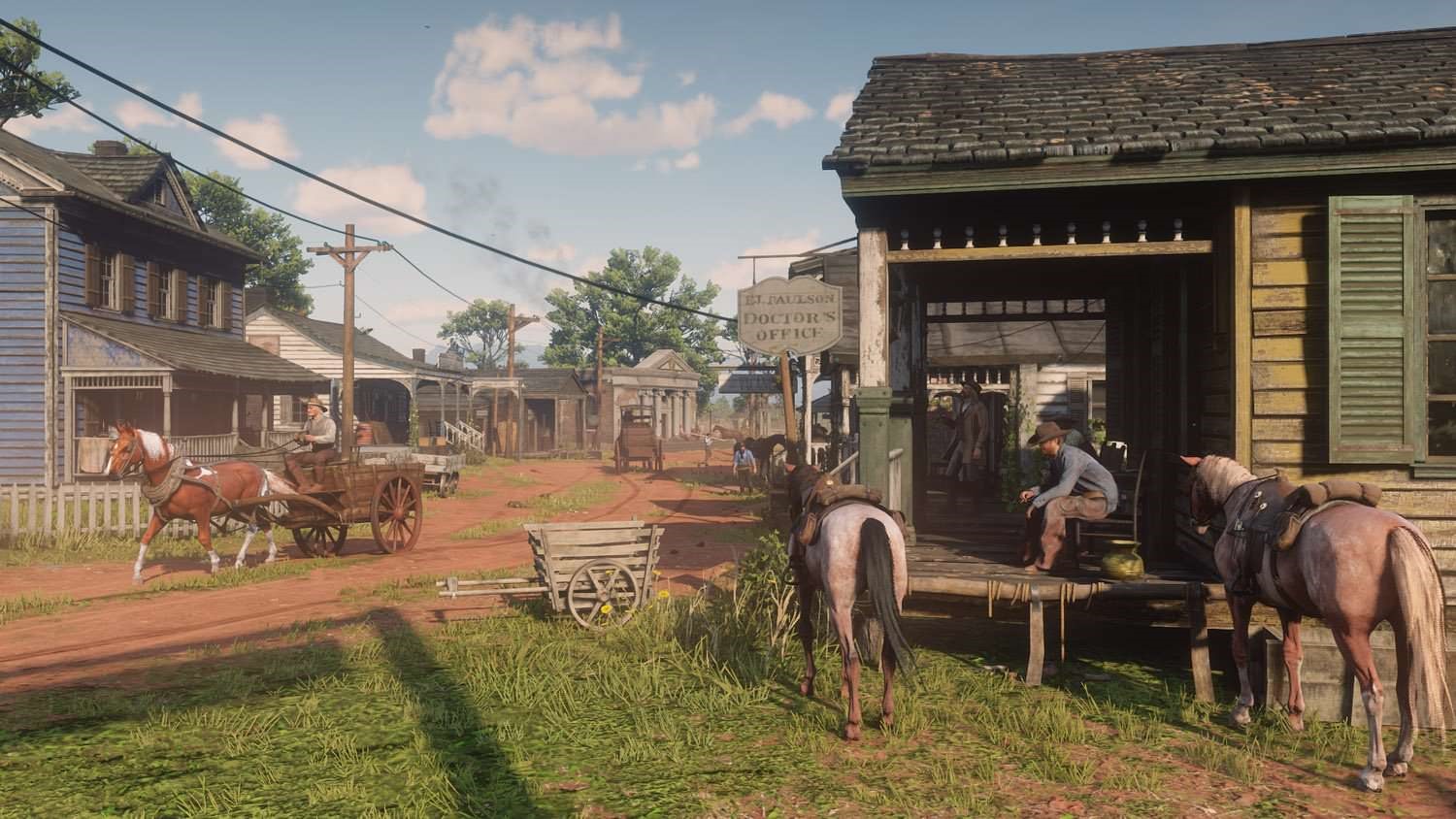 Red Dead Redemption 2 town scene with horses and carts HD Wallpaper