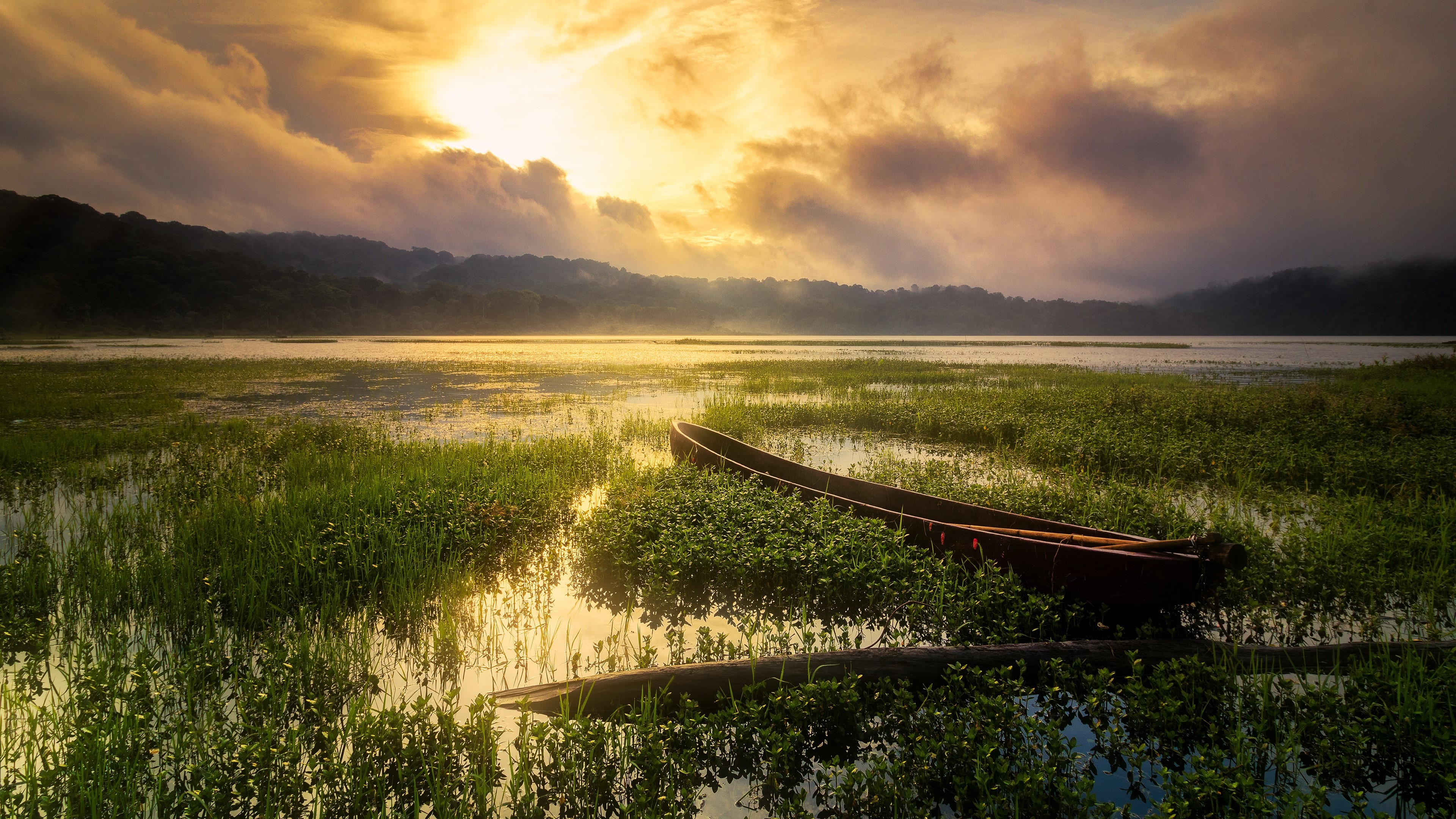 4K boat on a lake at sunset HD Wallpaper