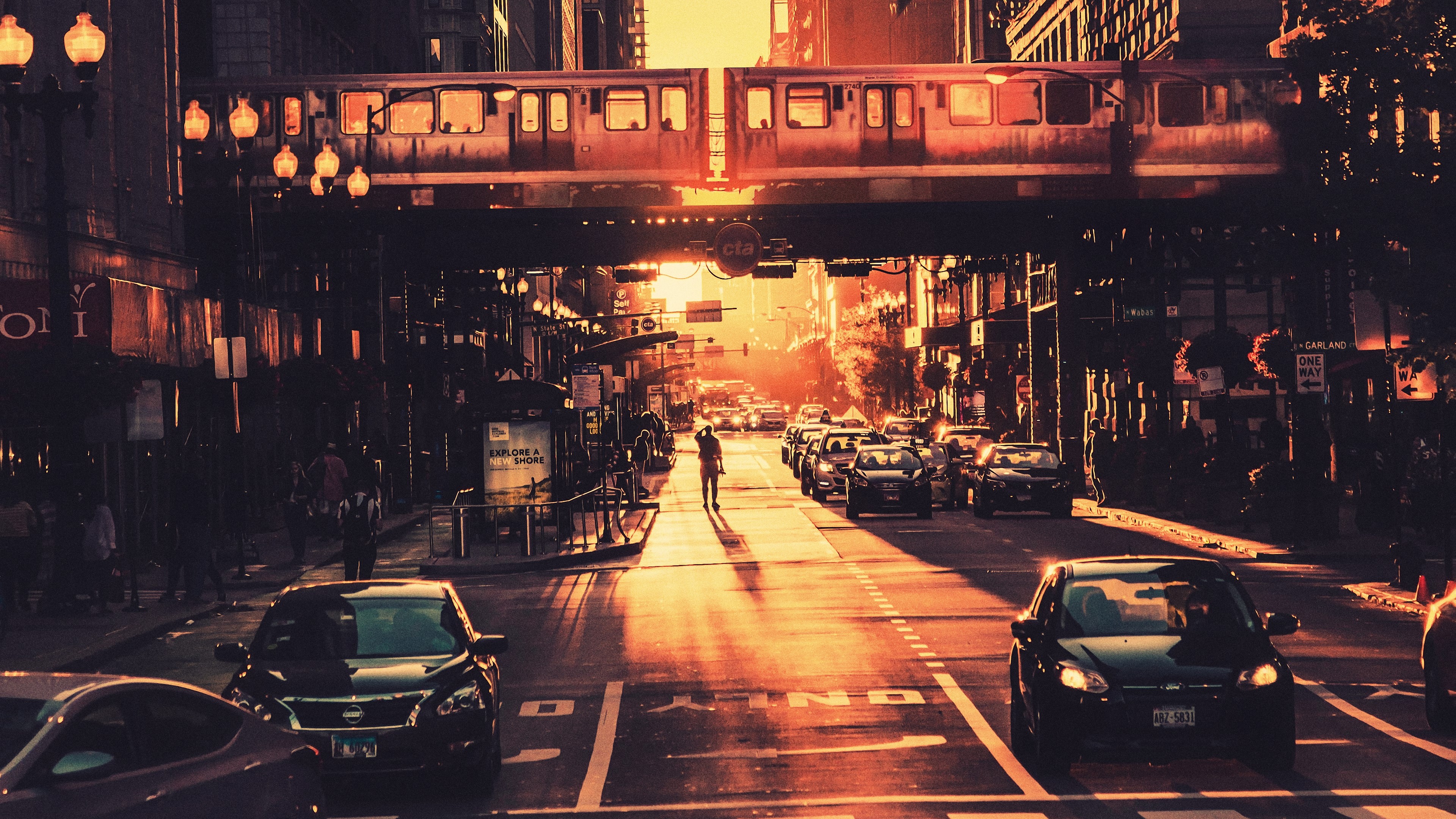 Chicago cityscape with elevated train and traffic at sunset HD Wallpaper