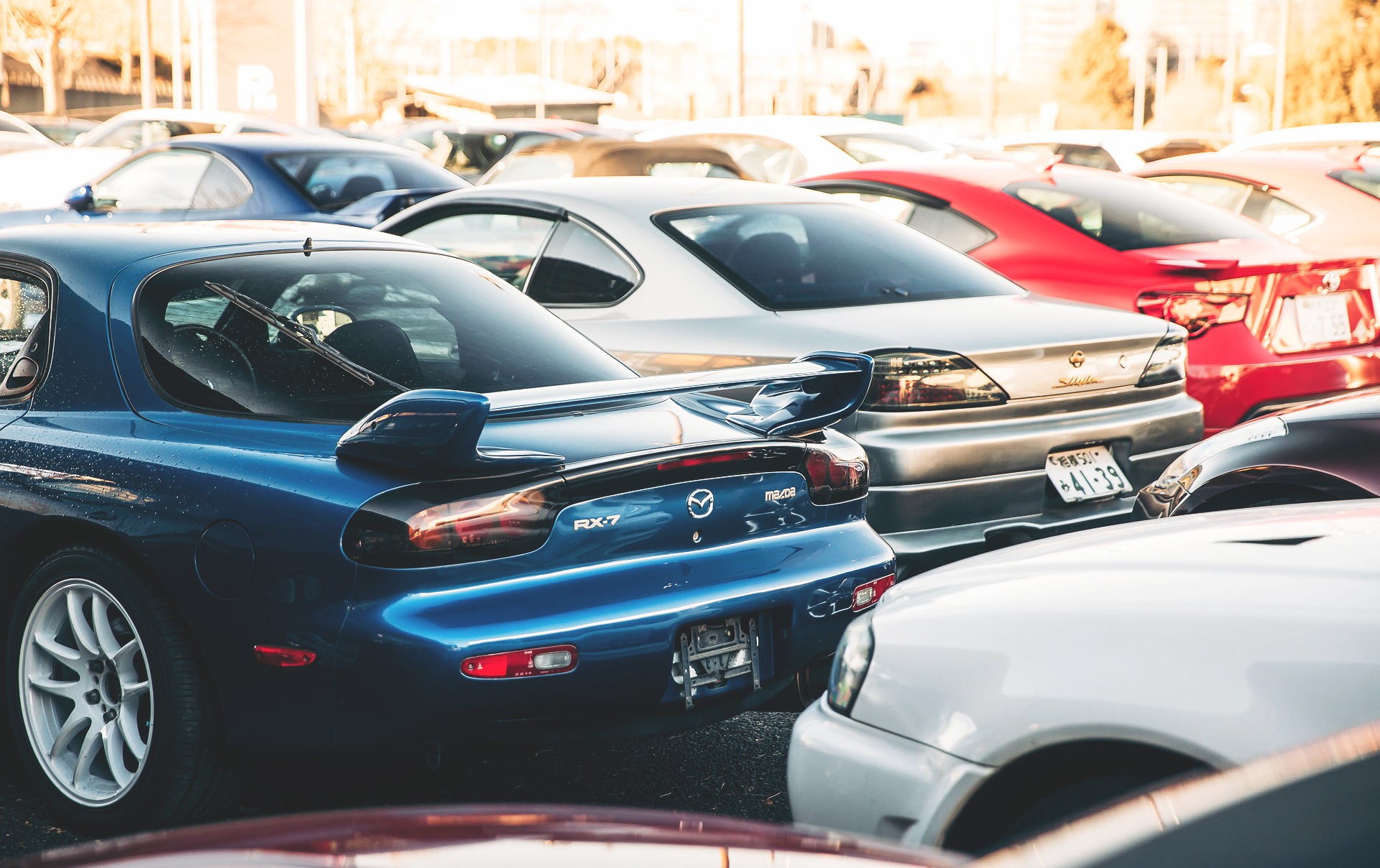 Mazda RX-7 FD and Nissan Silvia S15 cars parked HD Wallpaper