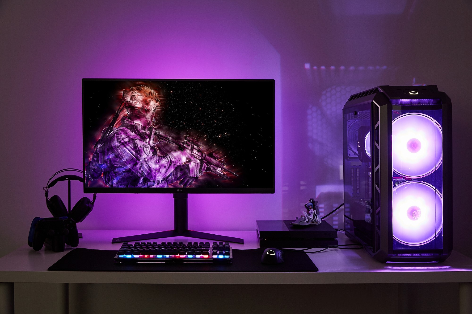 Gaming PC setup with monitor, keyboard, and headphones HD Wallpaper
