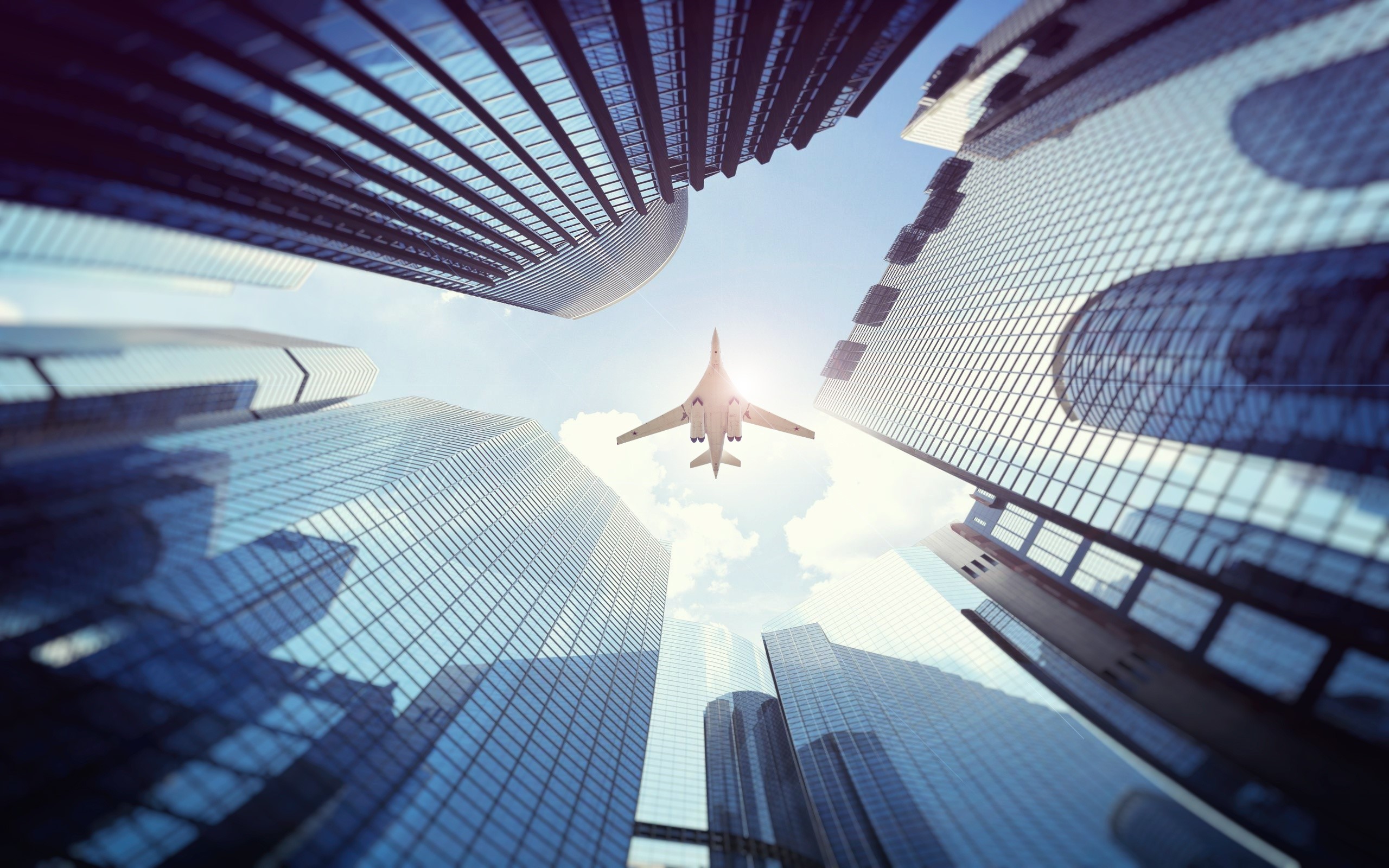 Tupolev Tu-160 flying over skyscrapers HD Wallpaper