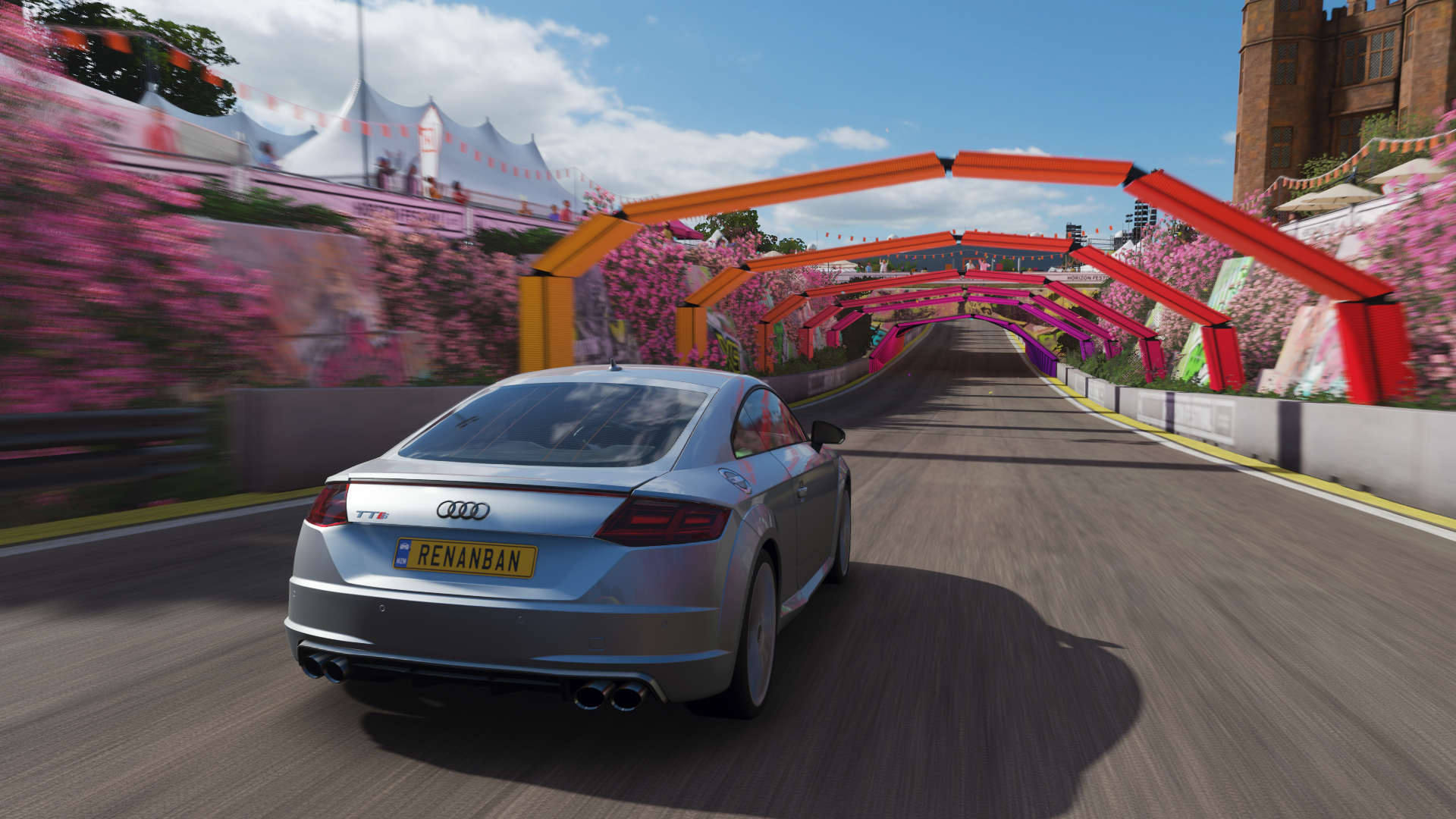Audi TT RS driving through a colorful tunnel in Forza Horizon 4 HD Wallpaper
