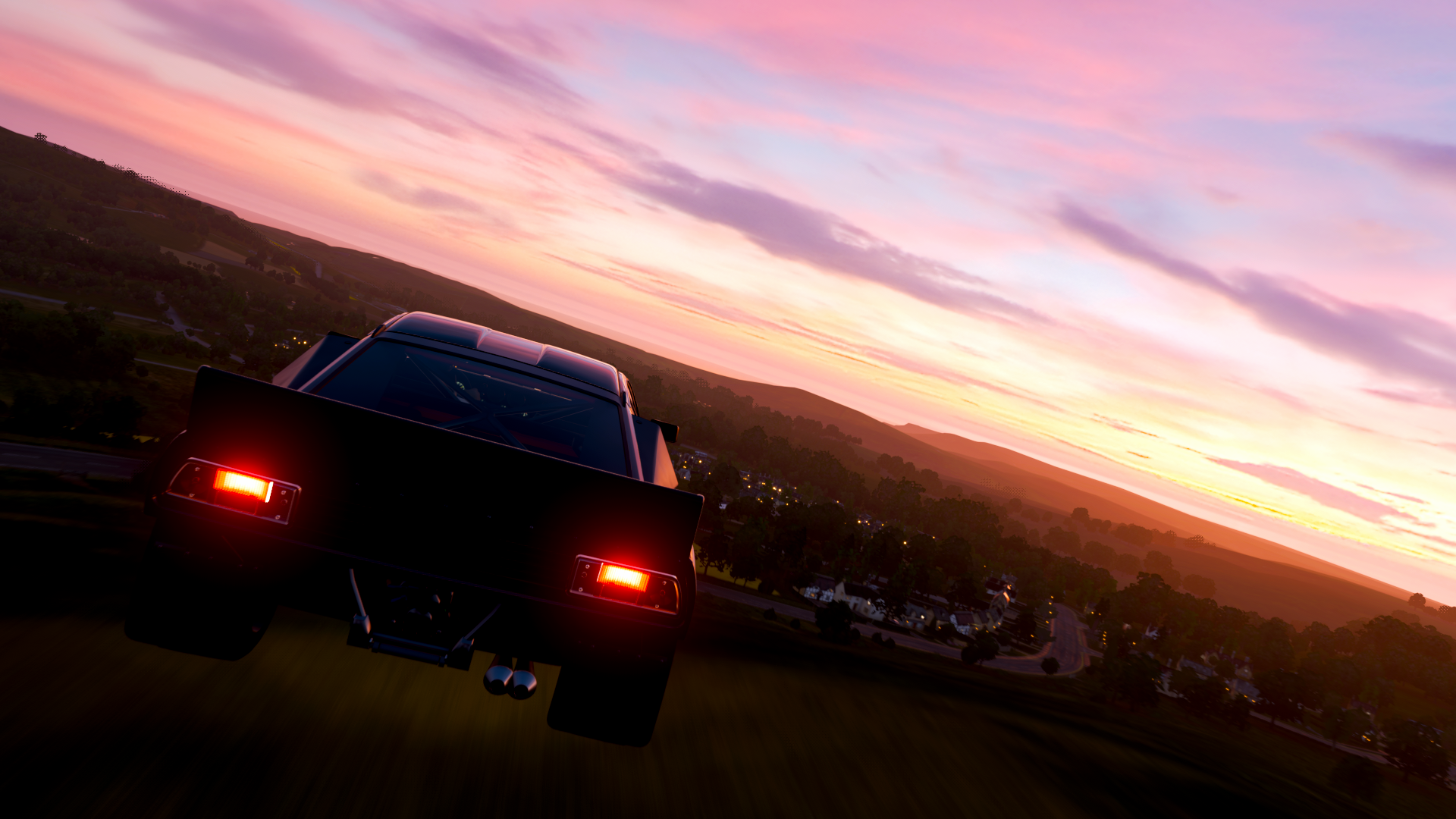 Car driving through a landscape at sunset in Forza Horizon 4 HD Wallpaper