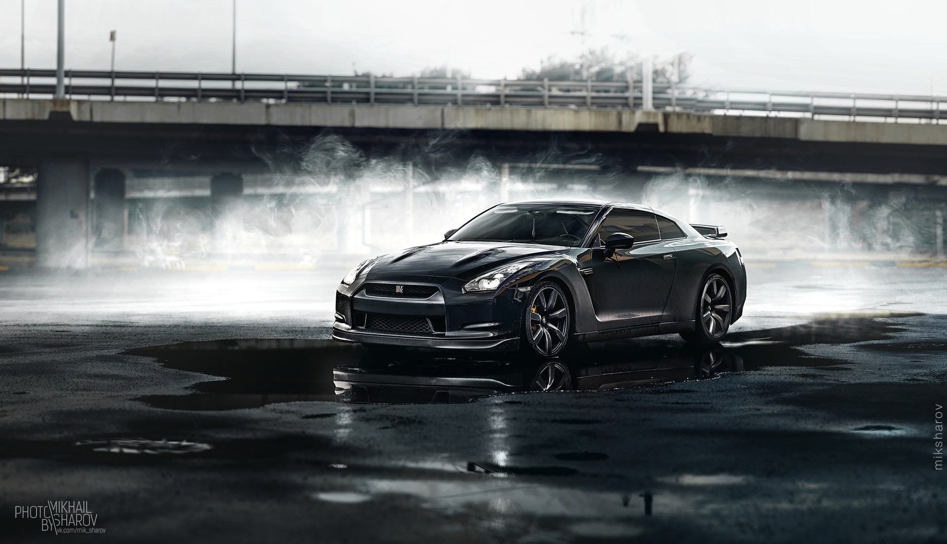Black Nissan GT-R on wet asphalt with smoke HD Wallpaper
