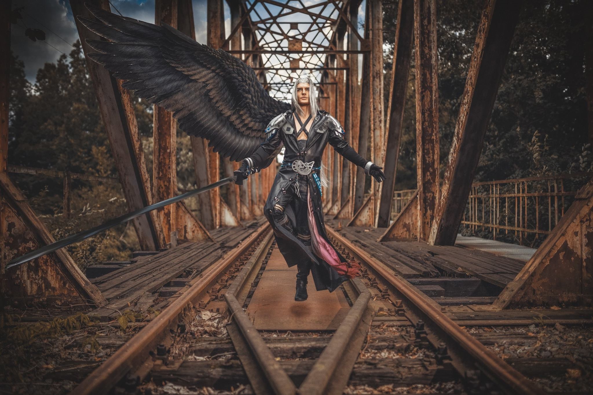 Sephiroth from Final Fantasy with wings and sword on a bridge HD Wallpaper
