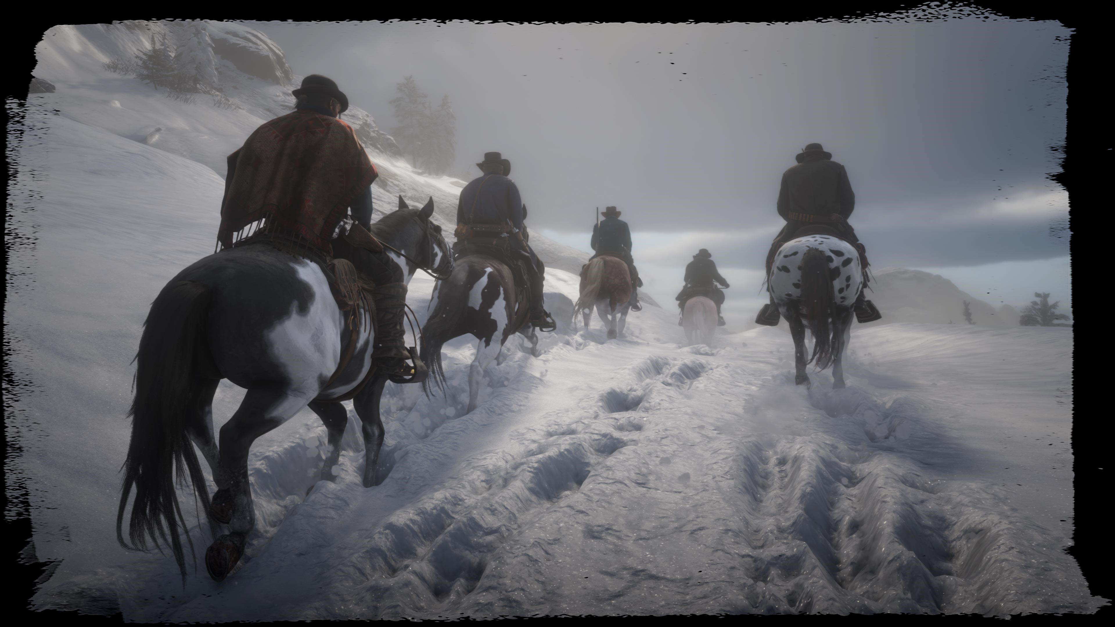 Cowboys riding horses through a snowy landscape in Red Dead Redemption 2 HD Wallpaper