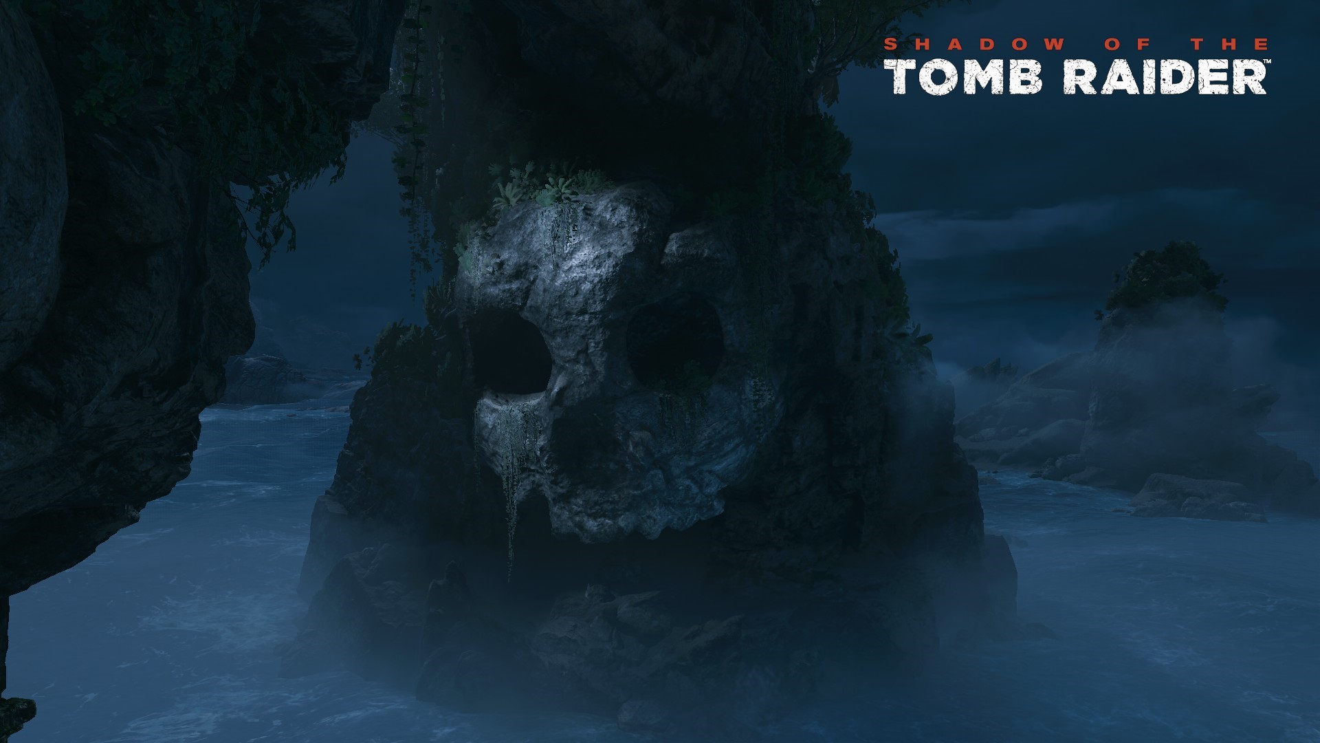Shadow of the Tomb Raider logo over a skull rock formation HD Wallpaper