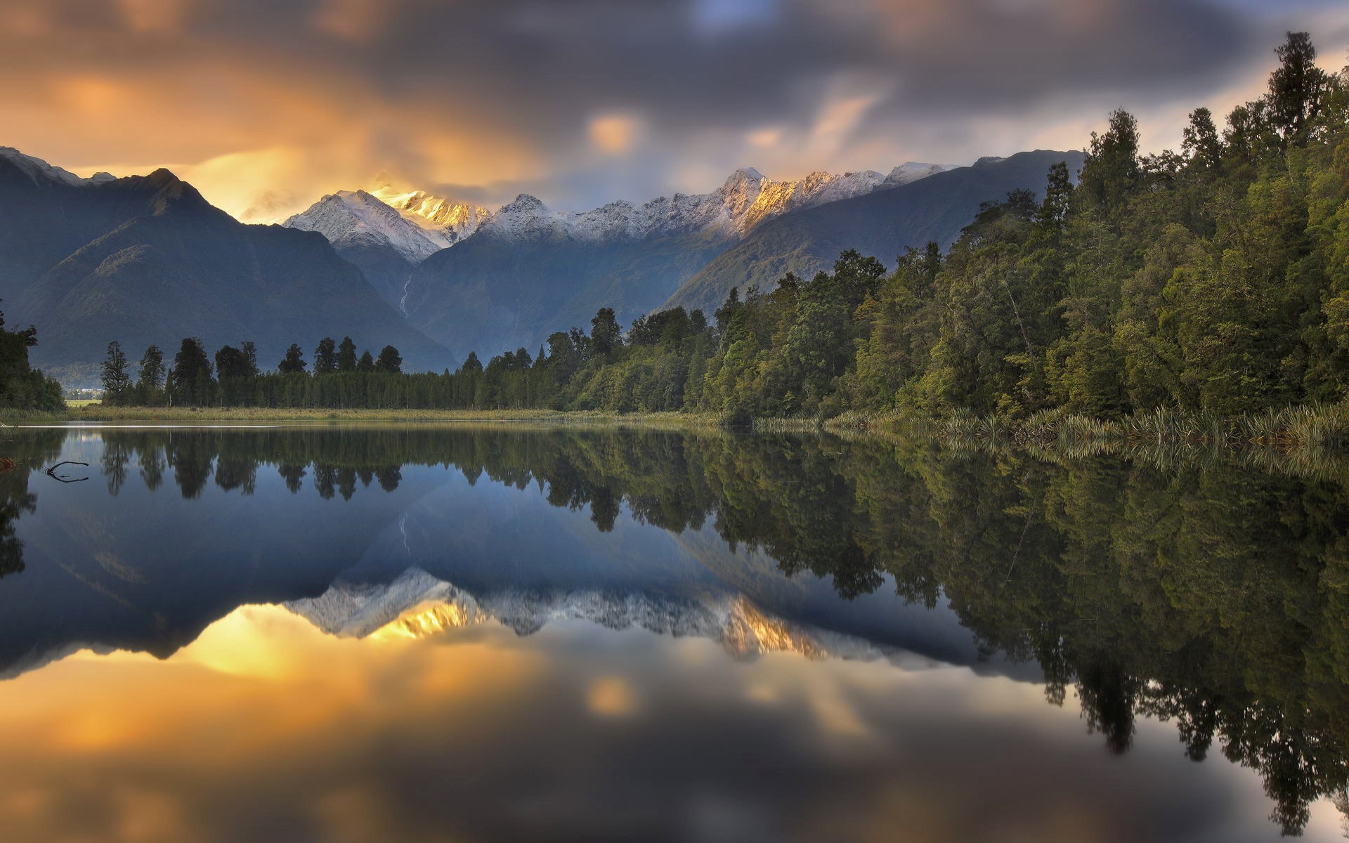 Lake reflection of mountains and forest at sunset HD Wallpaper