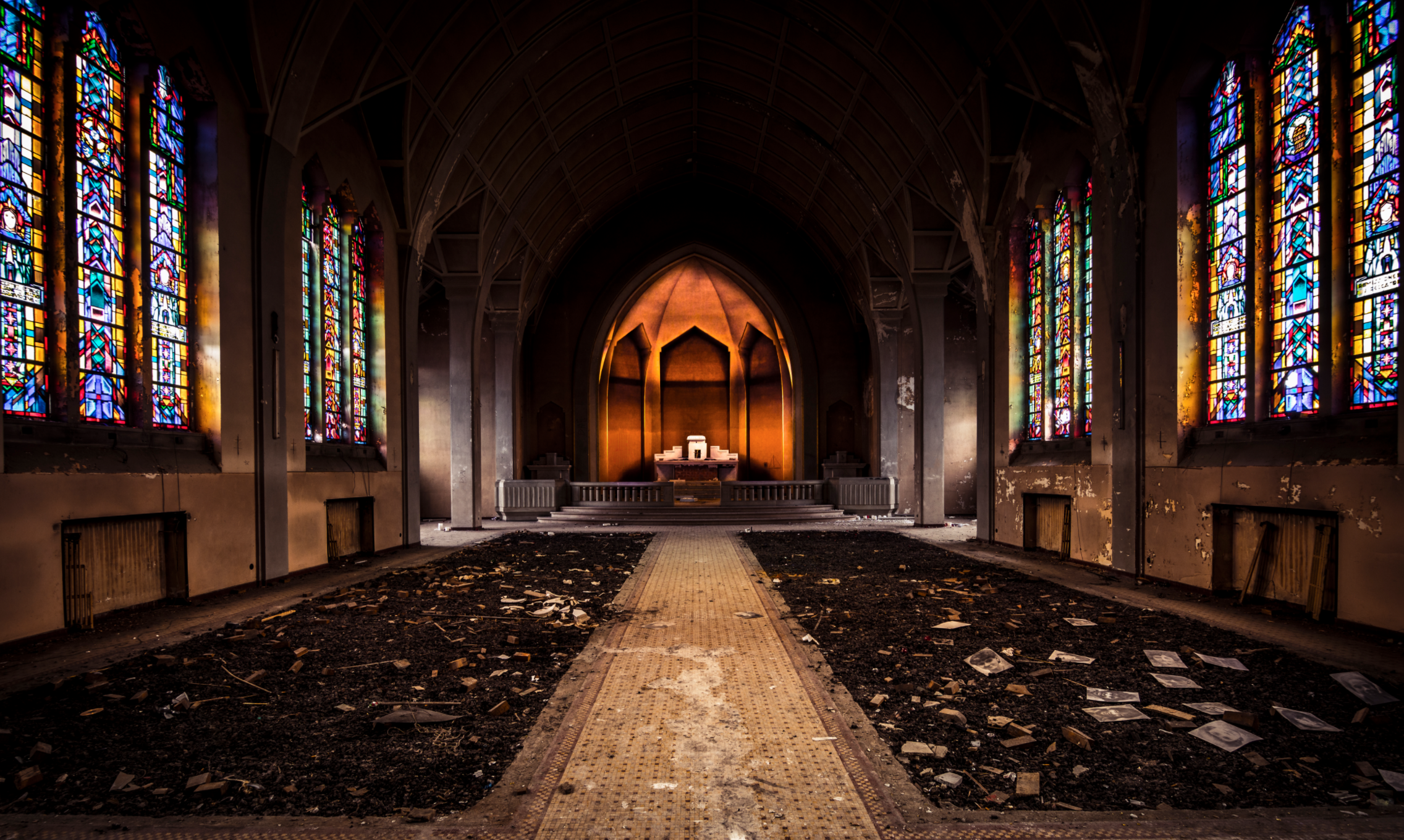 Abandoned church interior with stained glass and altar HD Wallpaper