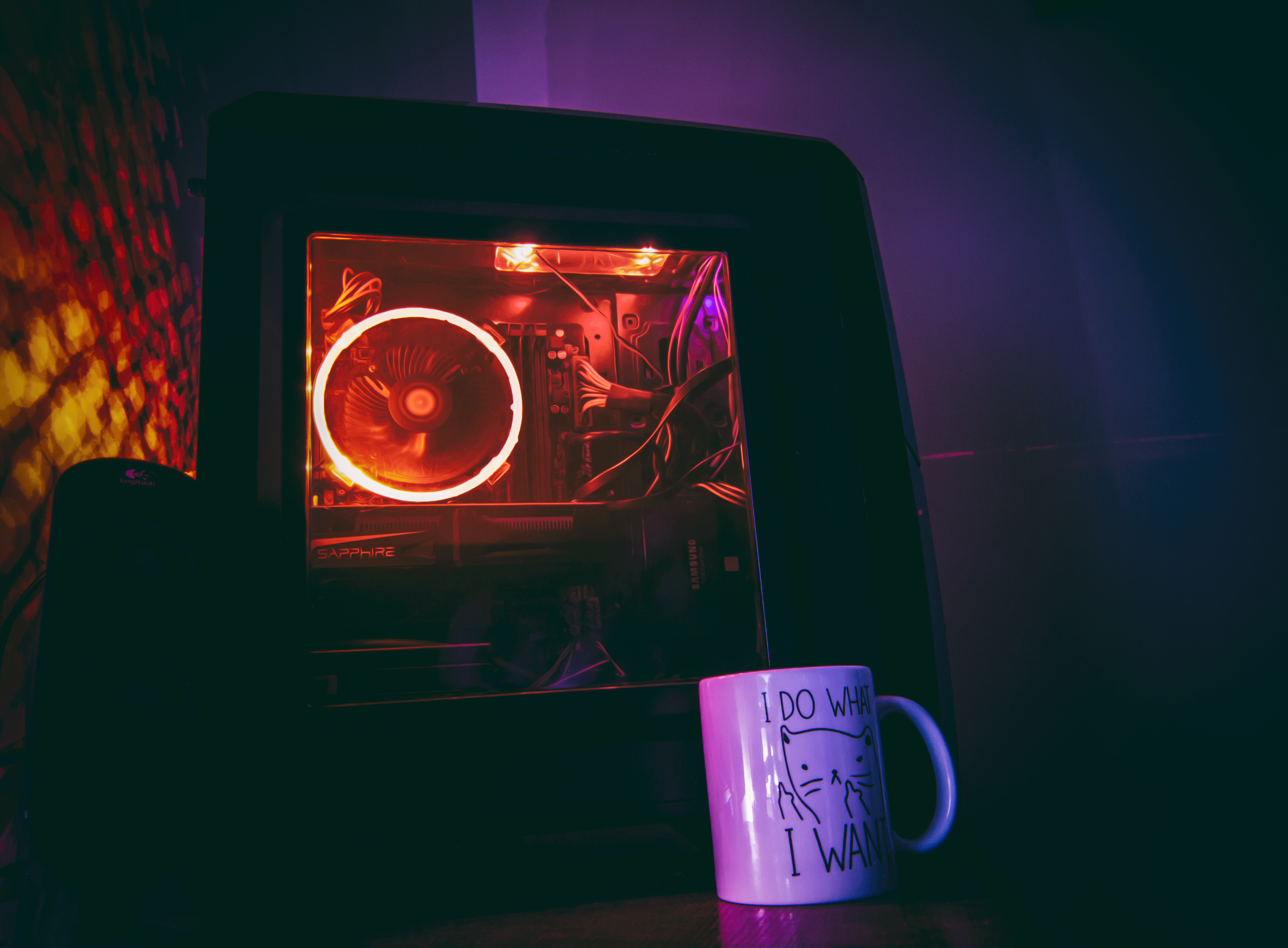PC gaming setup with RGB LEDs and a mug HD Wallpaper