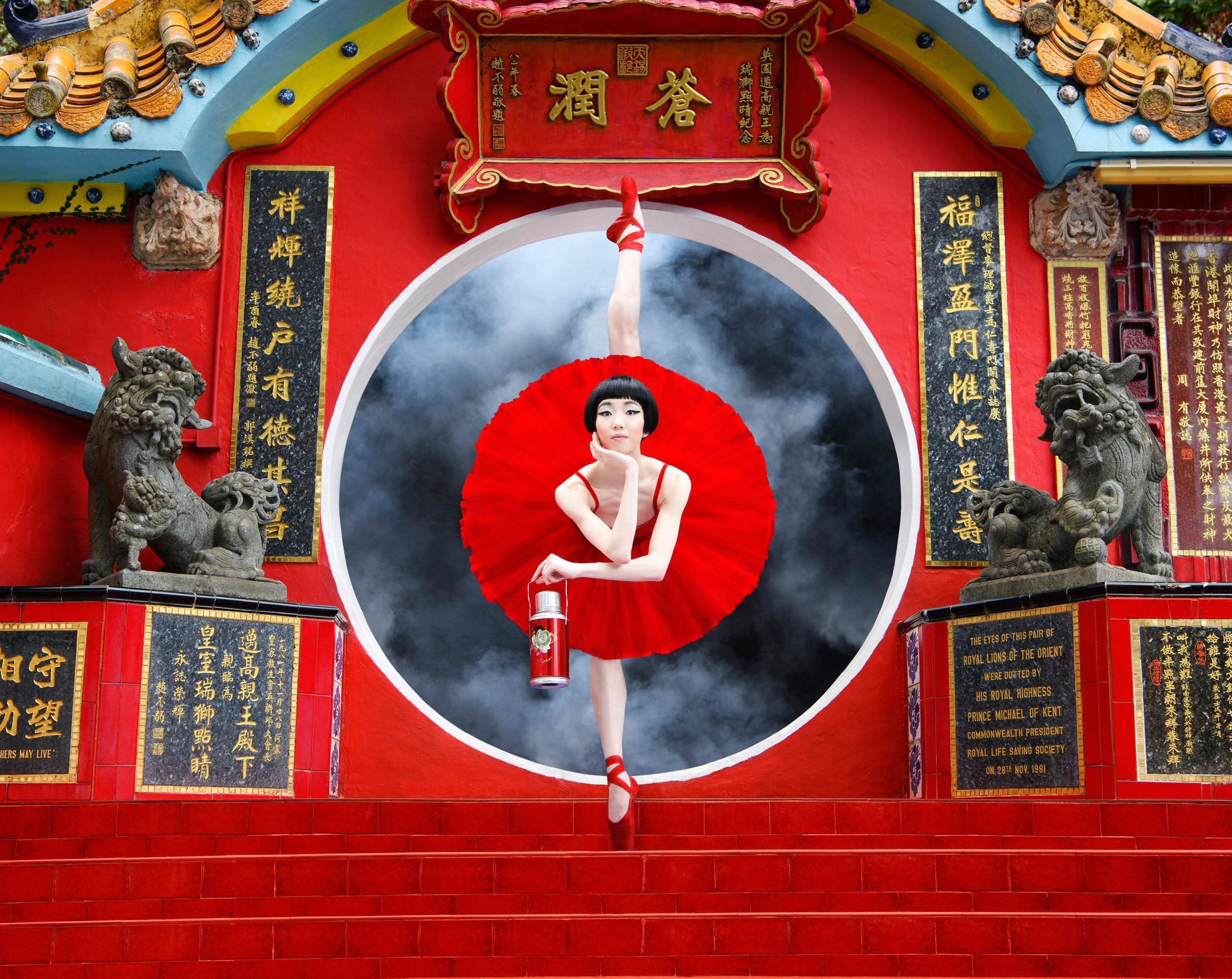 Ballerina in red tutu performing in front of Chinese temple HD Wallpaper