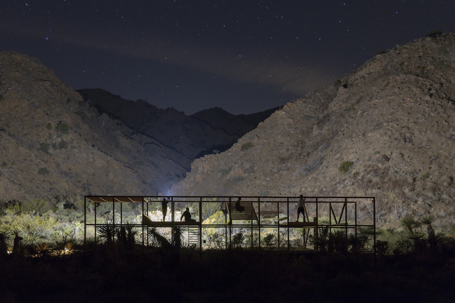 Modern house in mountains at night with stars HD Wallpaper