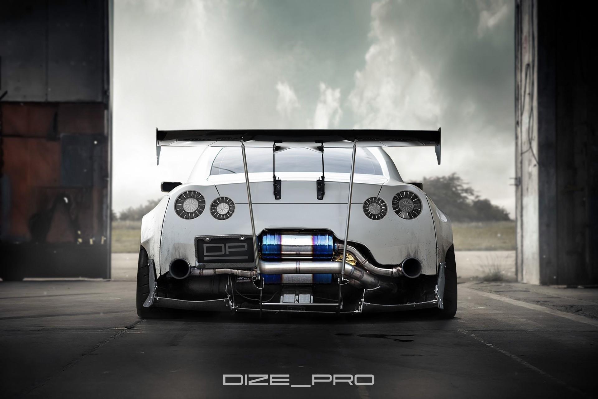 Nissan GT-R with large rear spoiler and exhaust HD Wallpaper
