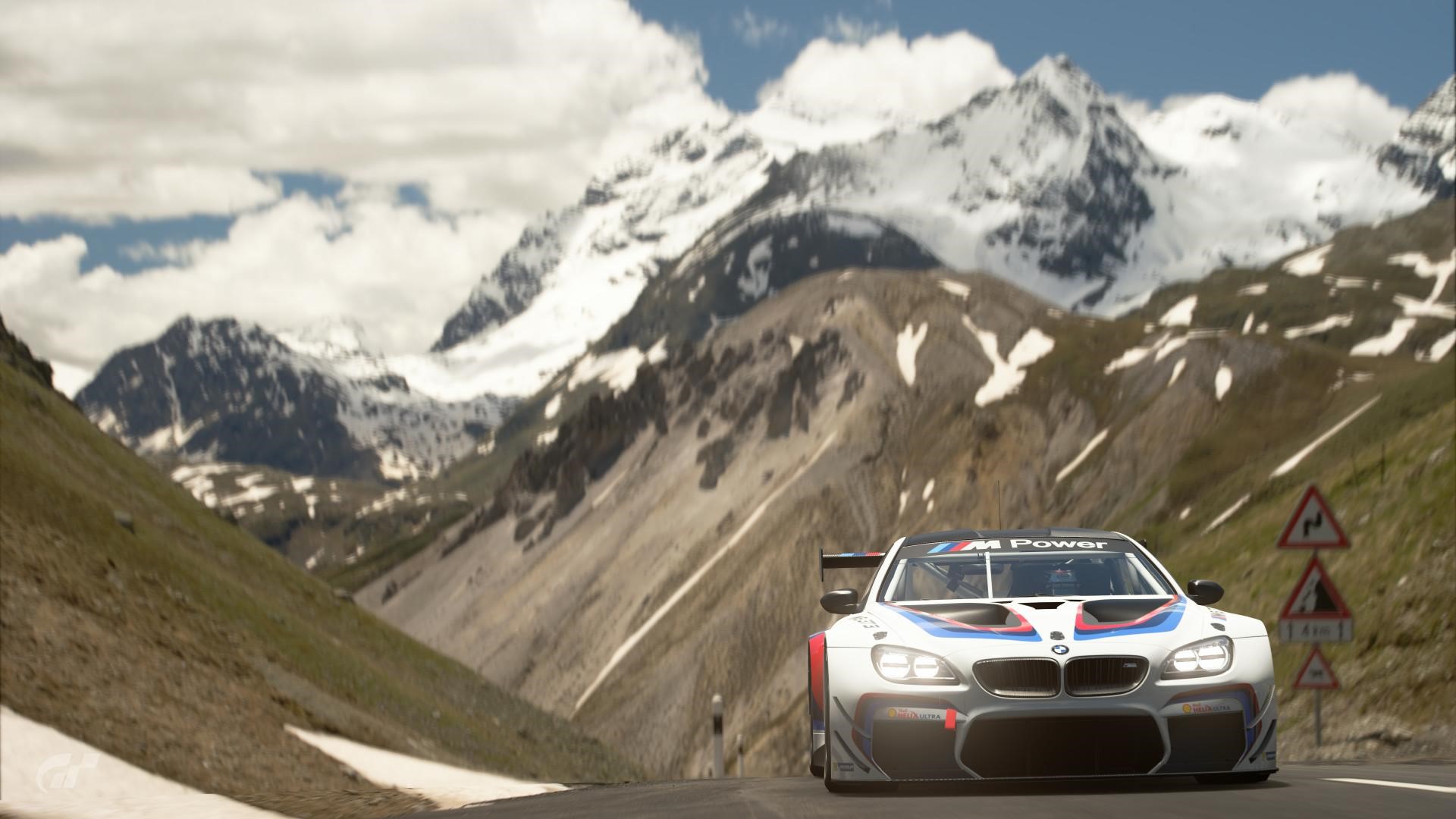 BMW M Power race car on mountain road HD Wallpaper