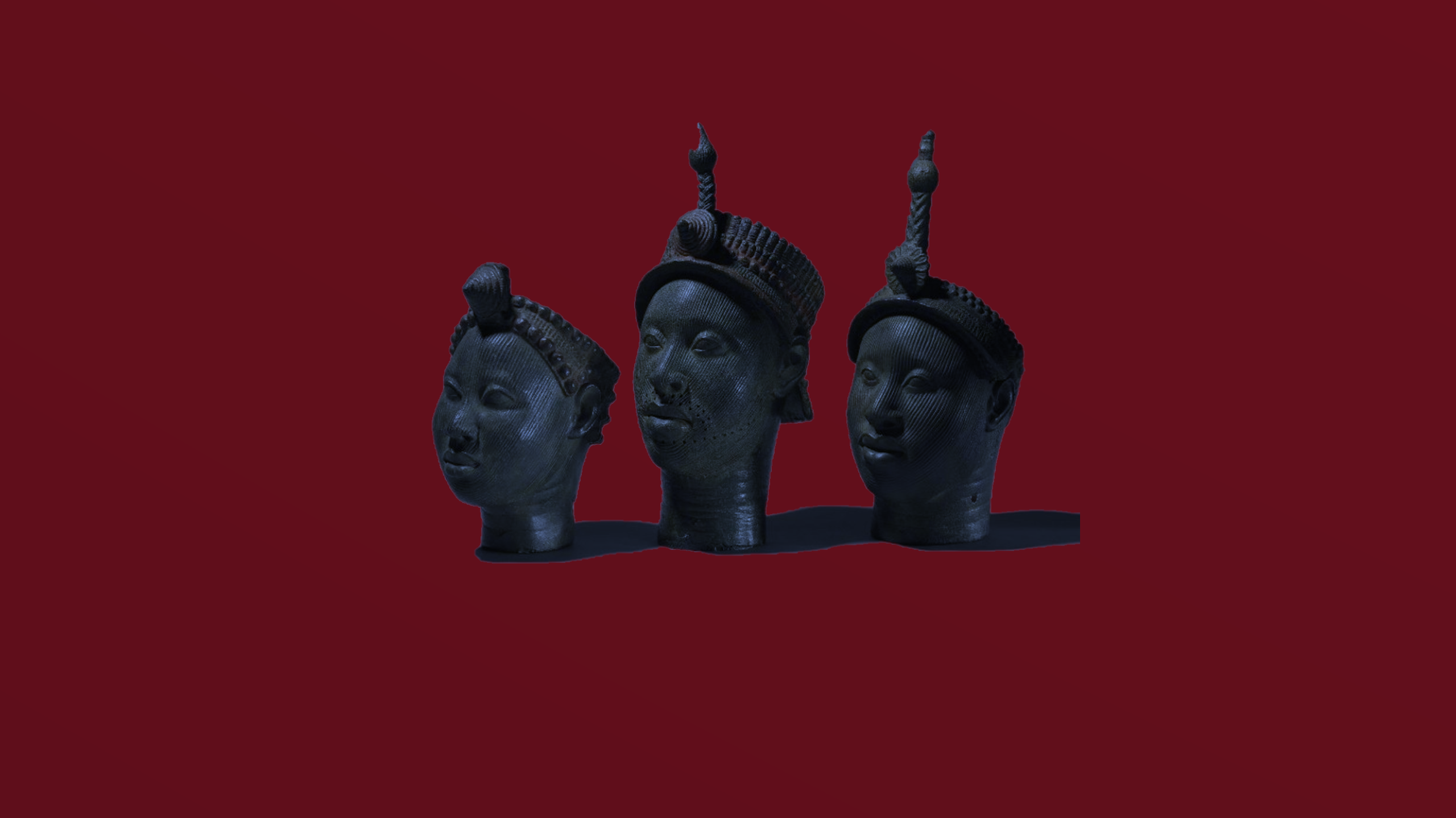 Three Benin Bronzes on a red background HD Wallpaper