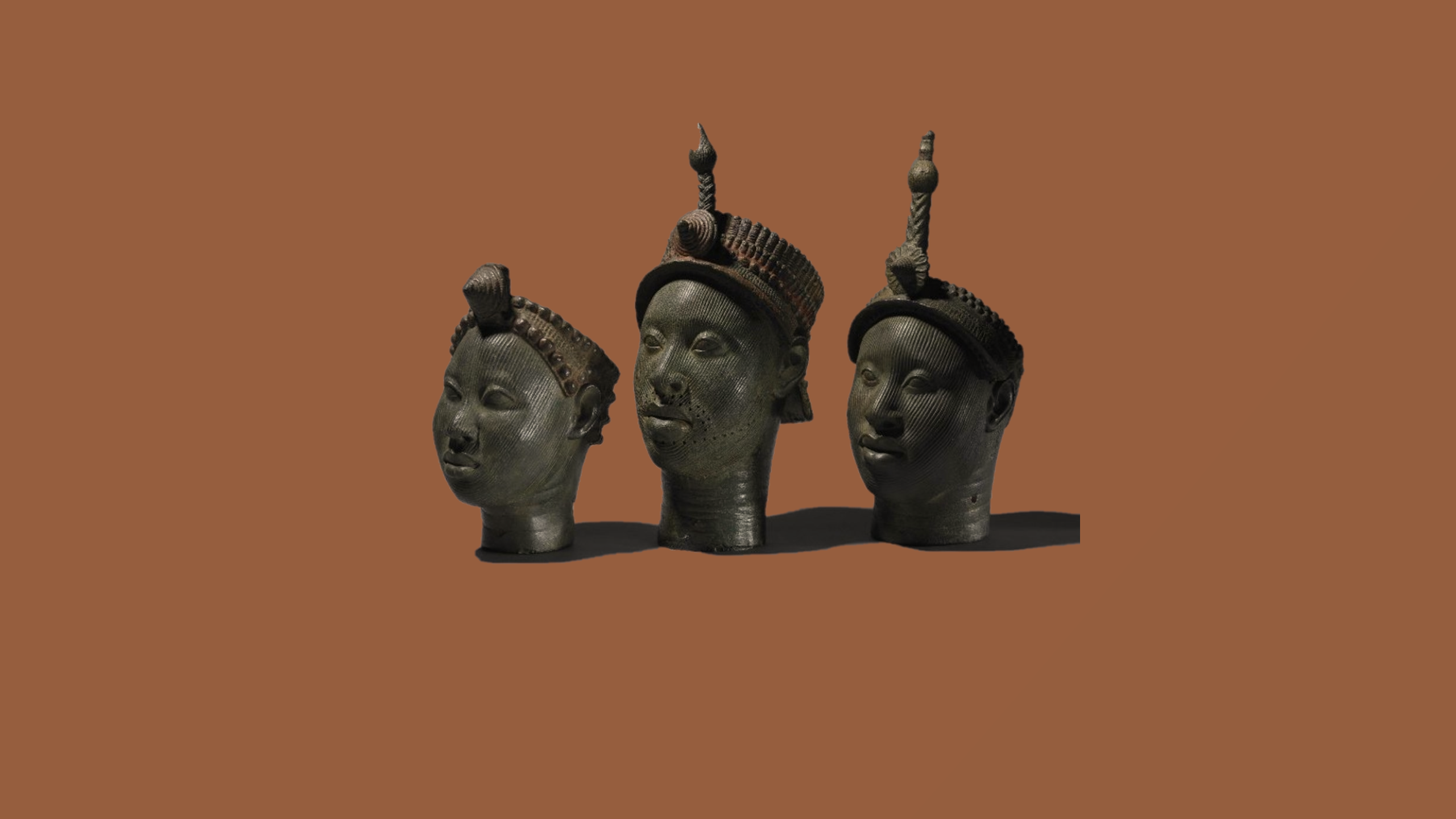 Three Benin Bronzes on a brown background HD Wallpaper