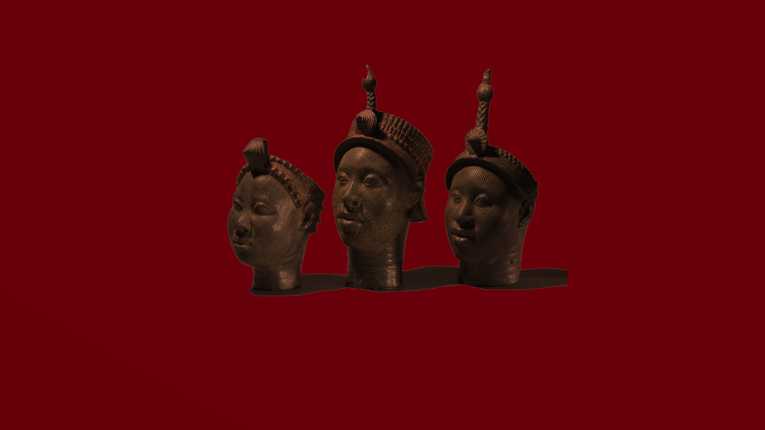 Three Benin Bronzes on a red background HD Wallpaper