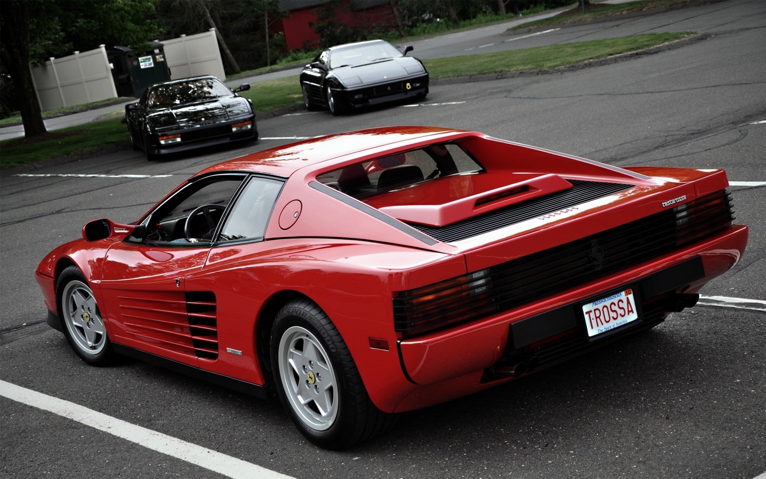 Three Ferrari Testarossa cars parked on a street HD Wallpaper