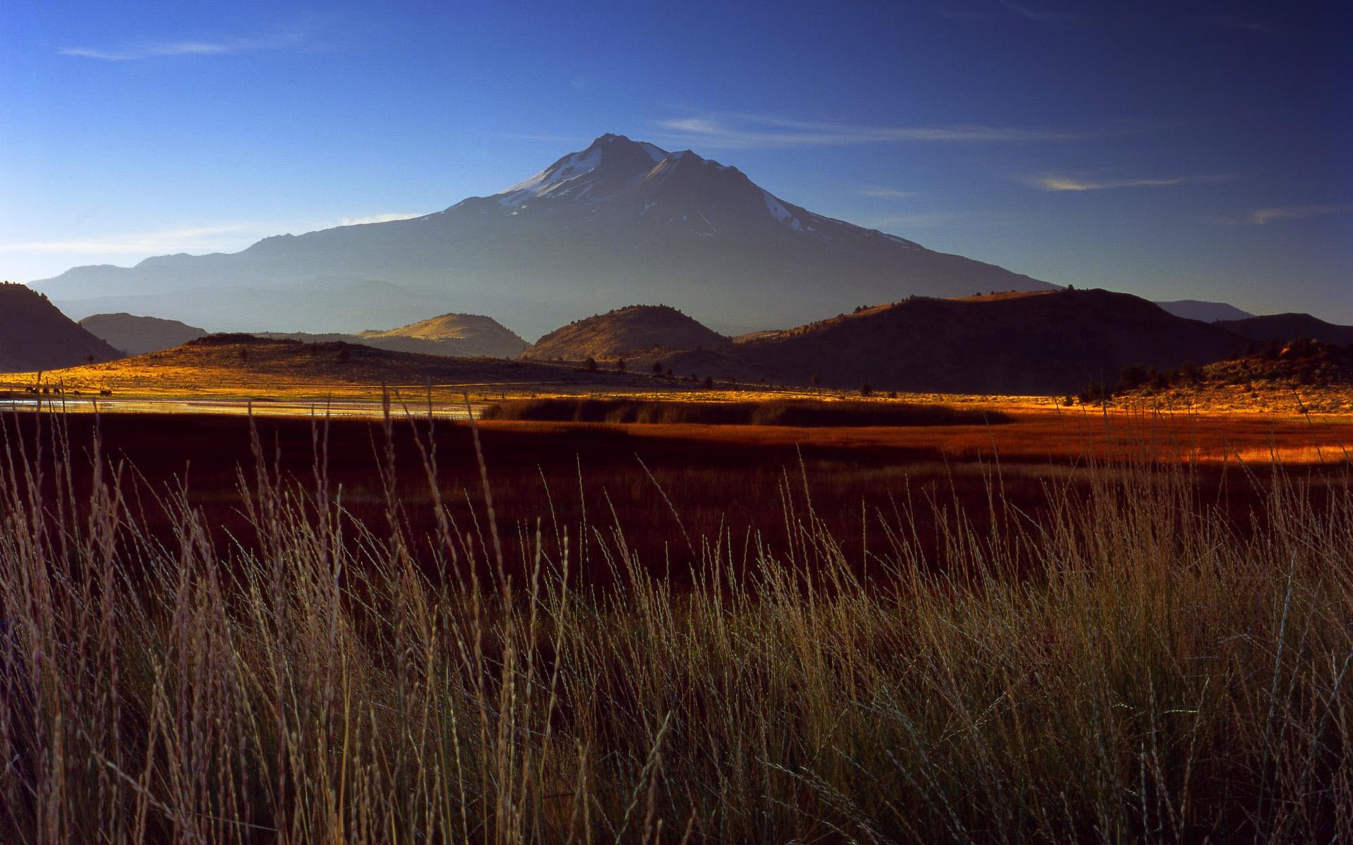 Mountain landscape with dry grass in the foreground HD Wallpaper