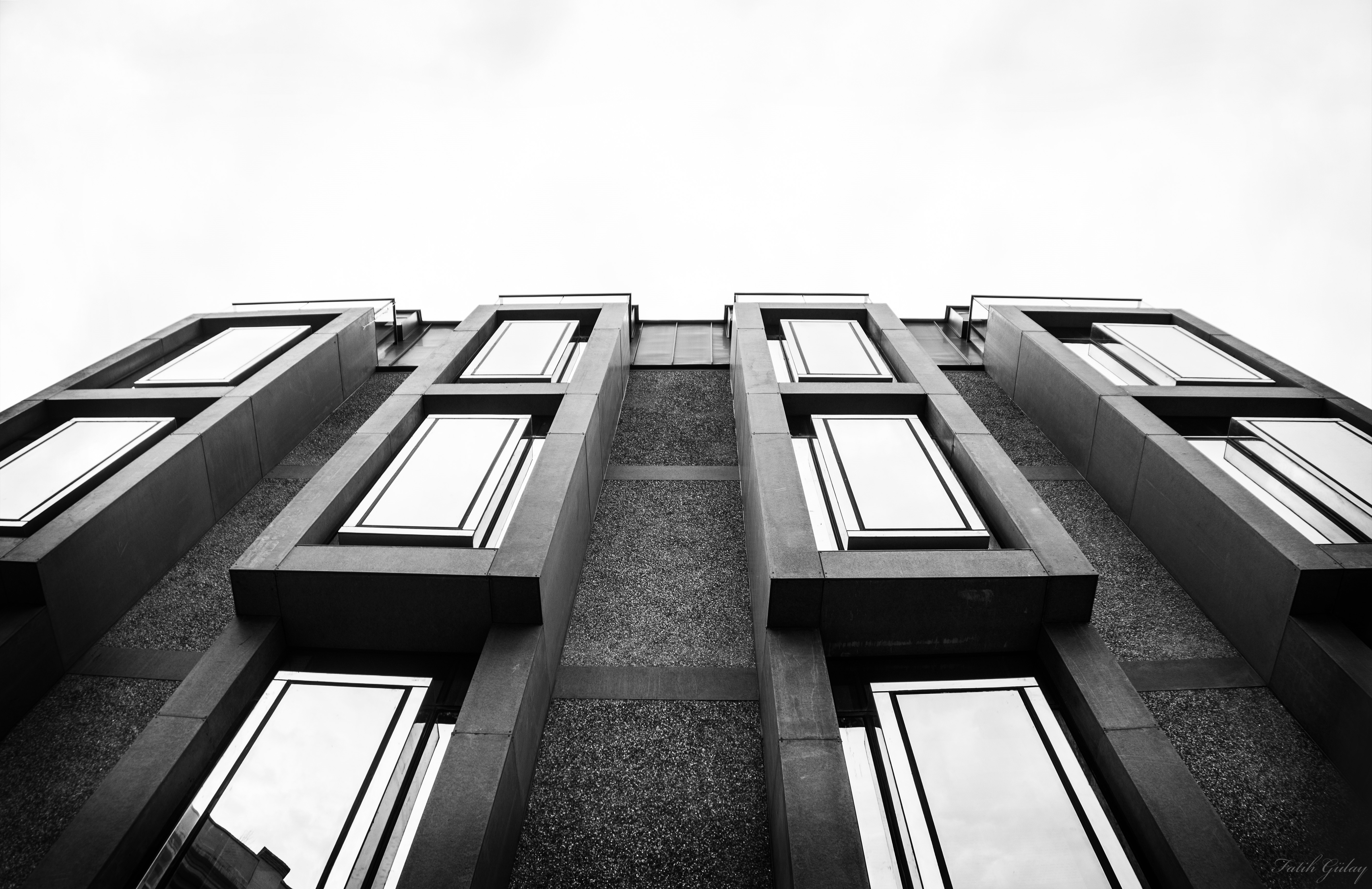 Monochrome building facade with repeating windows HD Wallpaper