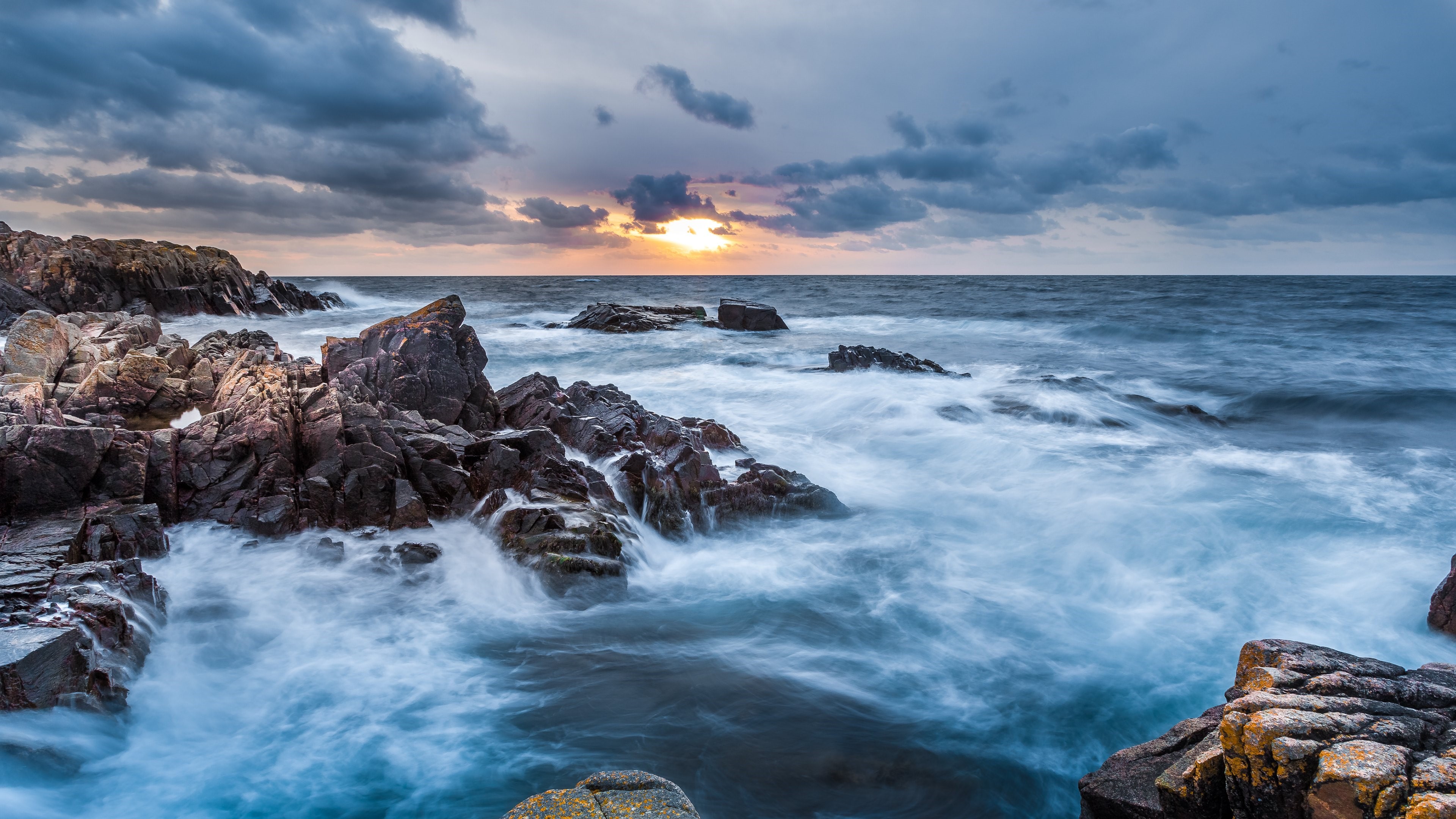 Rocky Coastline with Waves and Dramatic Clouds HD Wallpaper