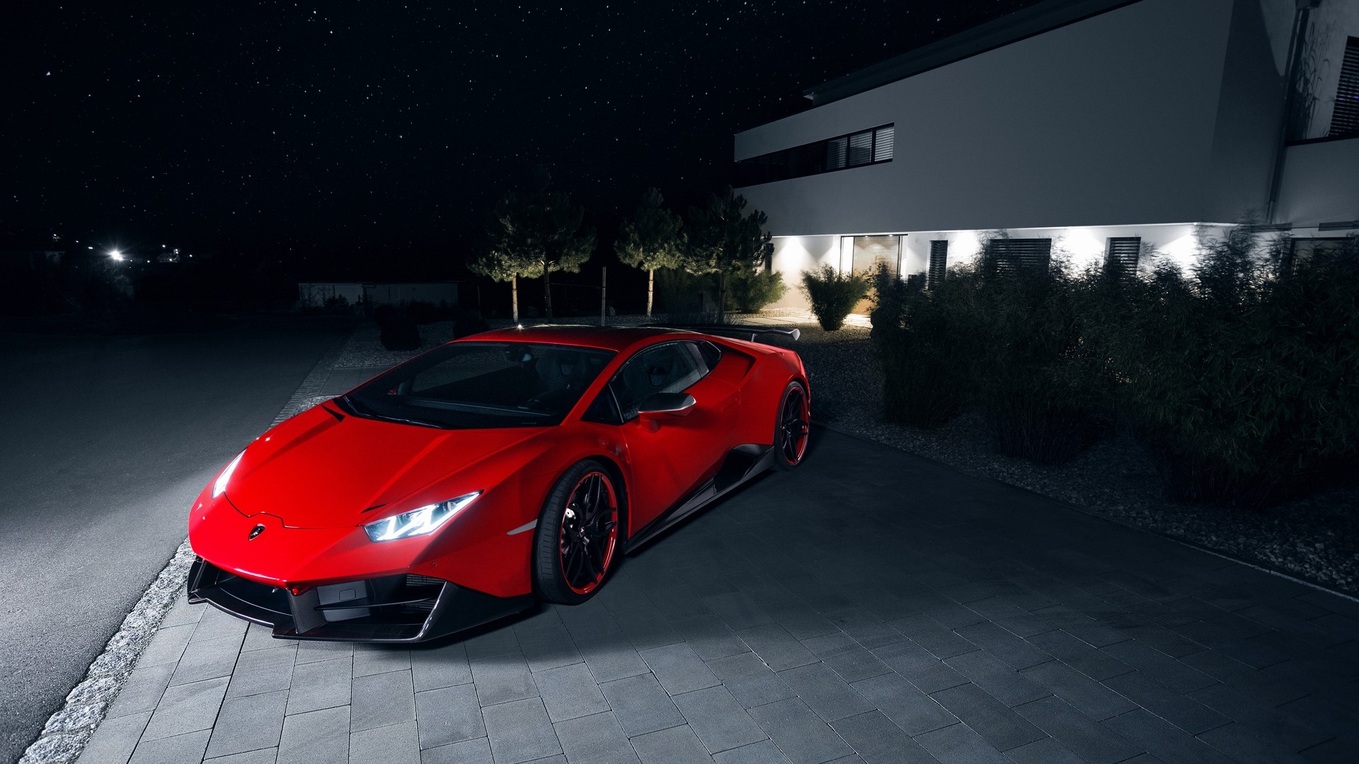 Red Lamborghini sports car parked at night HD Wallpaper