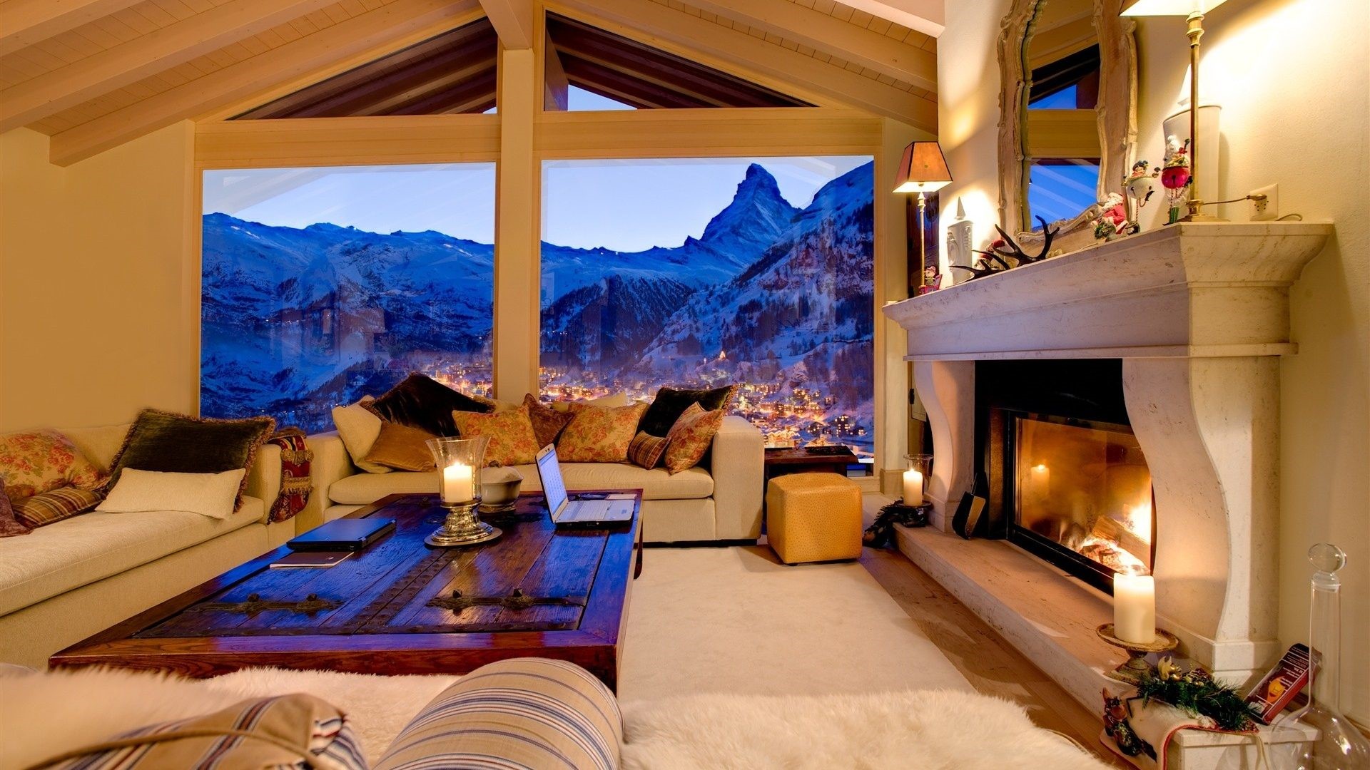 Cozy living room with fireplace and mountain view HD Wallpaper