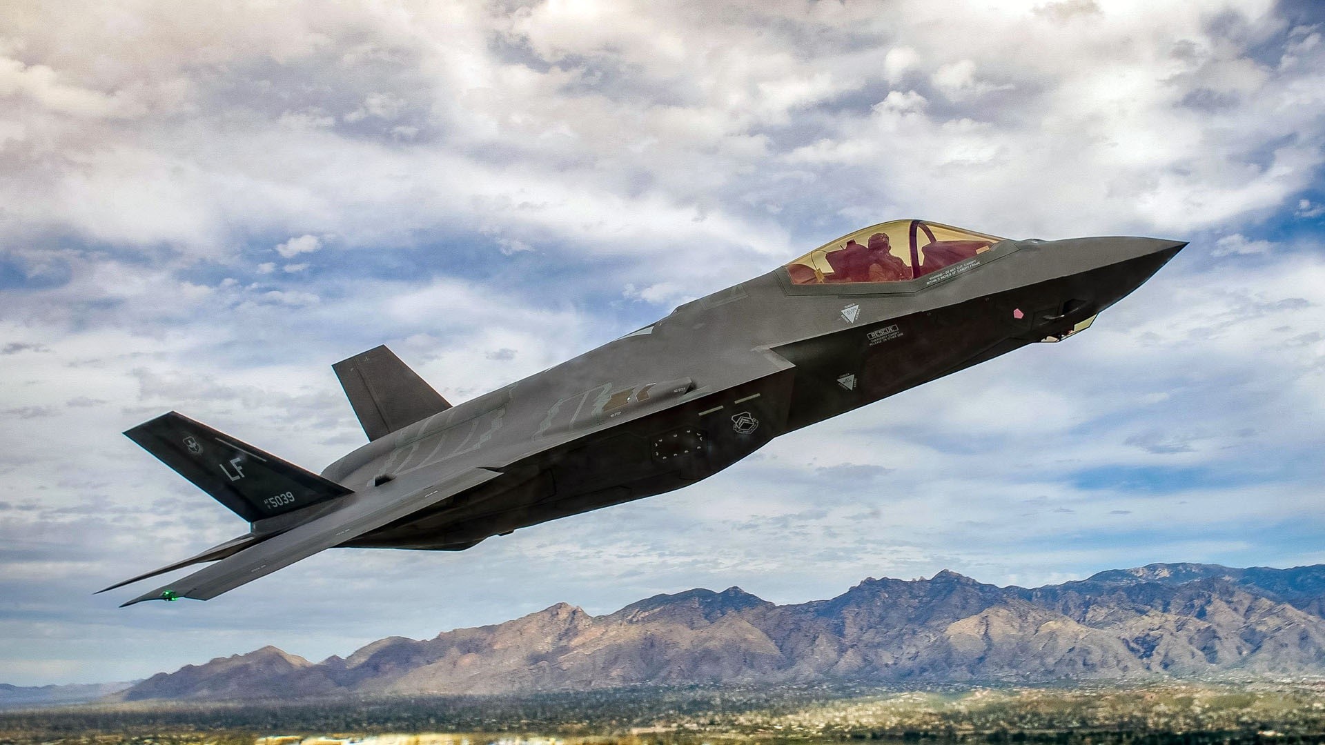 Lockheed Martin F-35 Lightning II flying over mountains HD Wallpaper