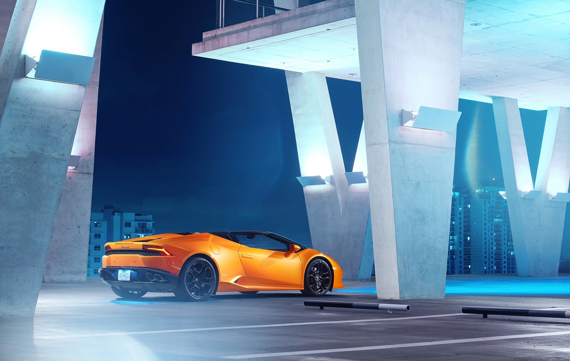 Orange Lamborghini Huracan convertible parked at night HD Wallpaper