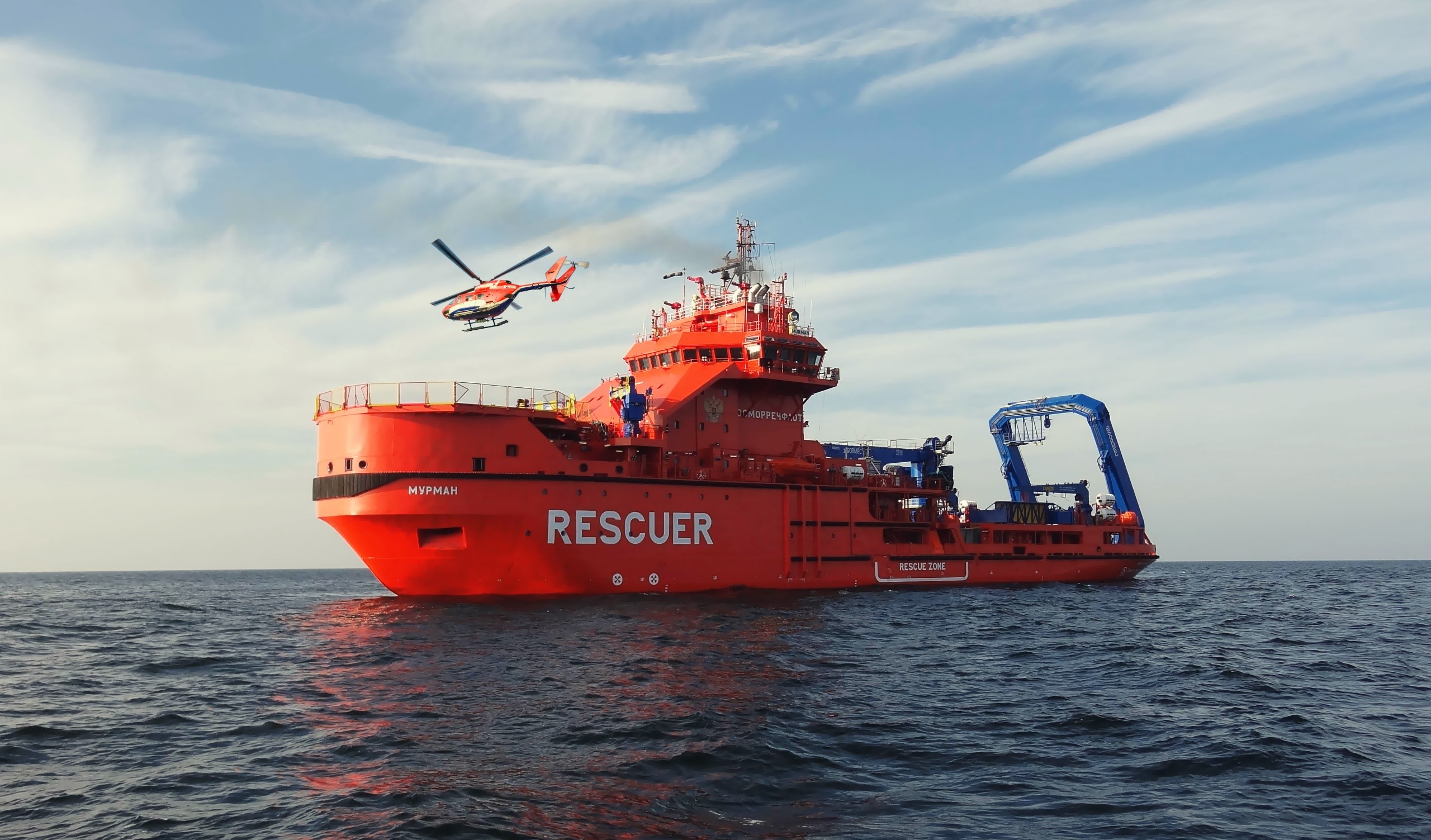 Red rescue ship and helicopter at sea HD Wallpaper
