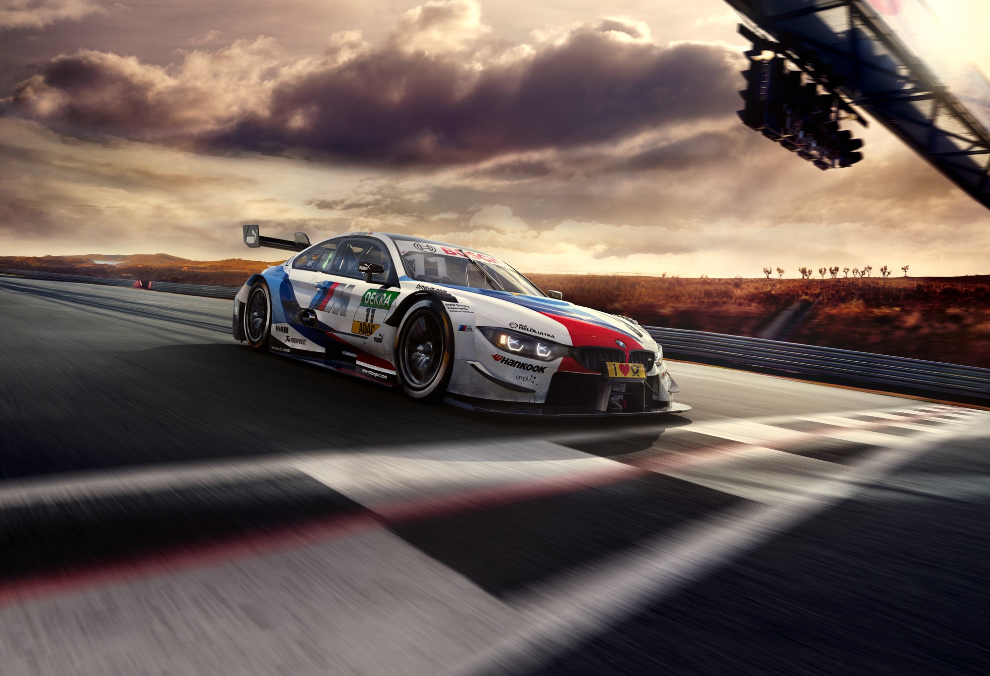 BMW M4 DTM race car on a track HD Wallpaper