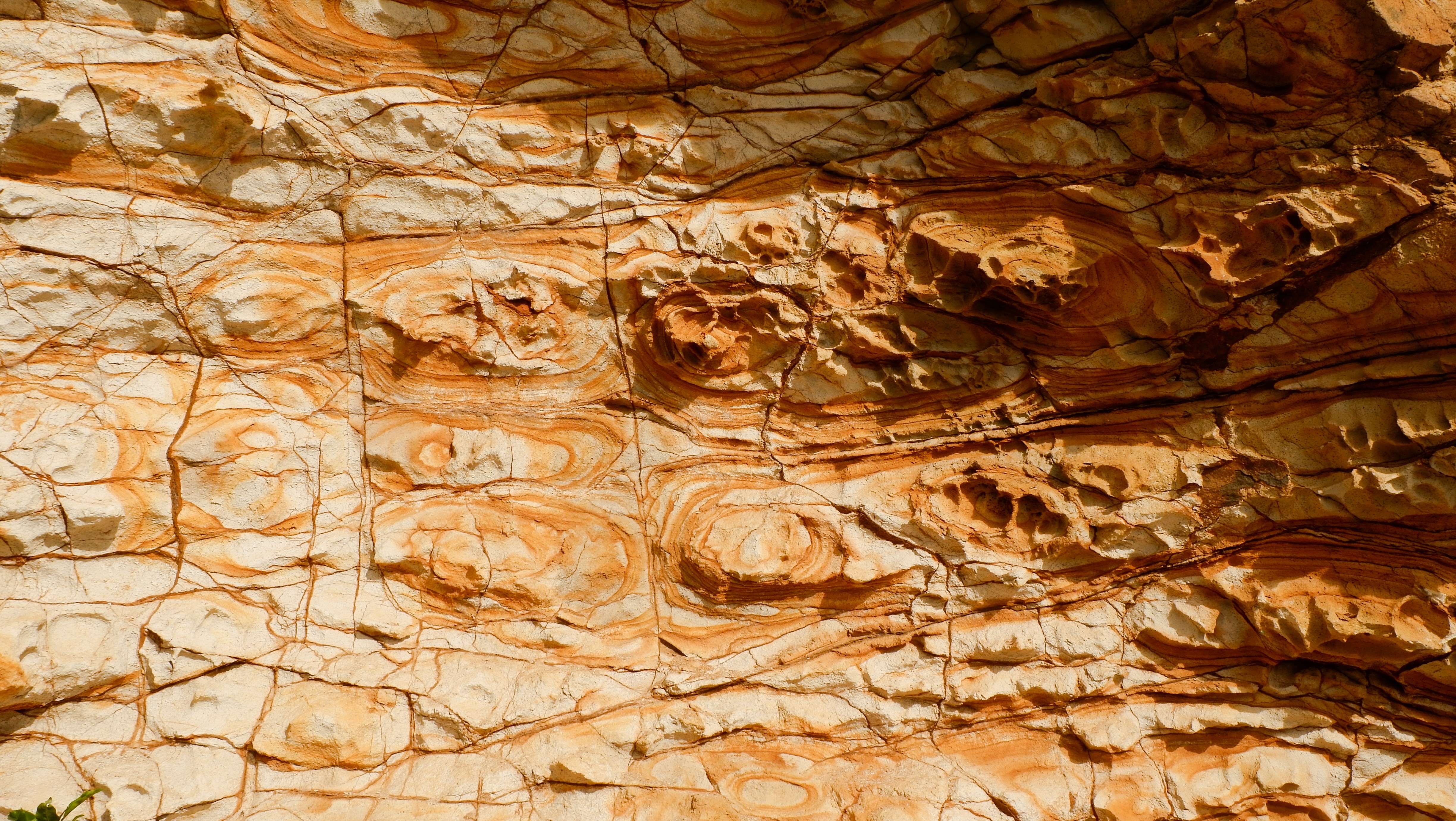 Rock formation with orange and white layers HD Wallpaper