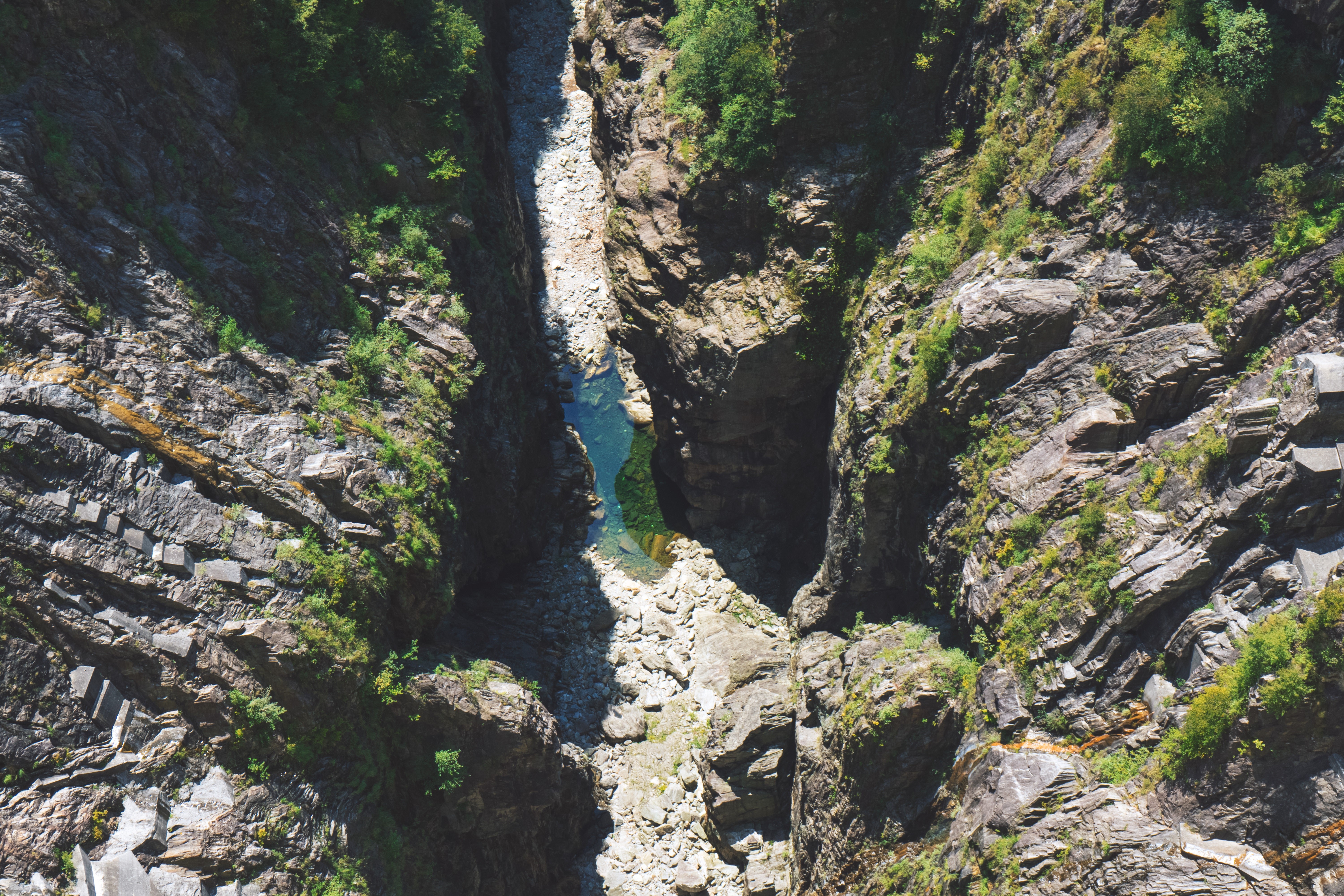 Aerial view of a rocky gorge with a river HD Wallpaper