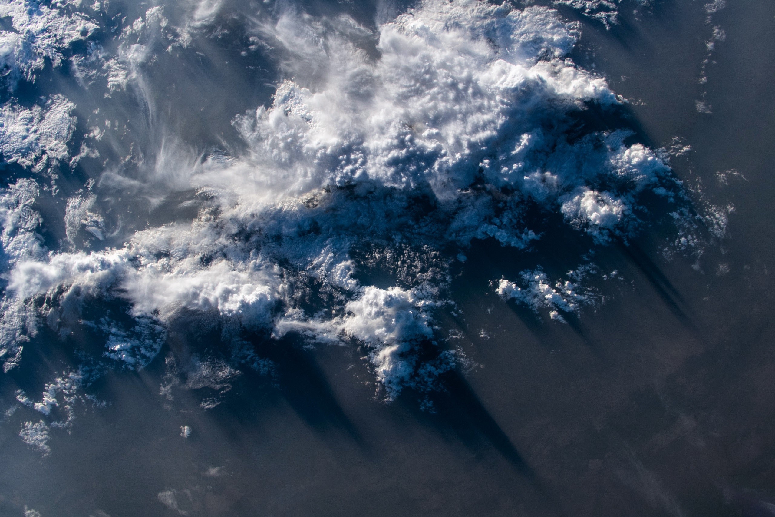 Aerial view of clouds casting shadows HD Wallpaper