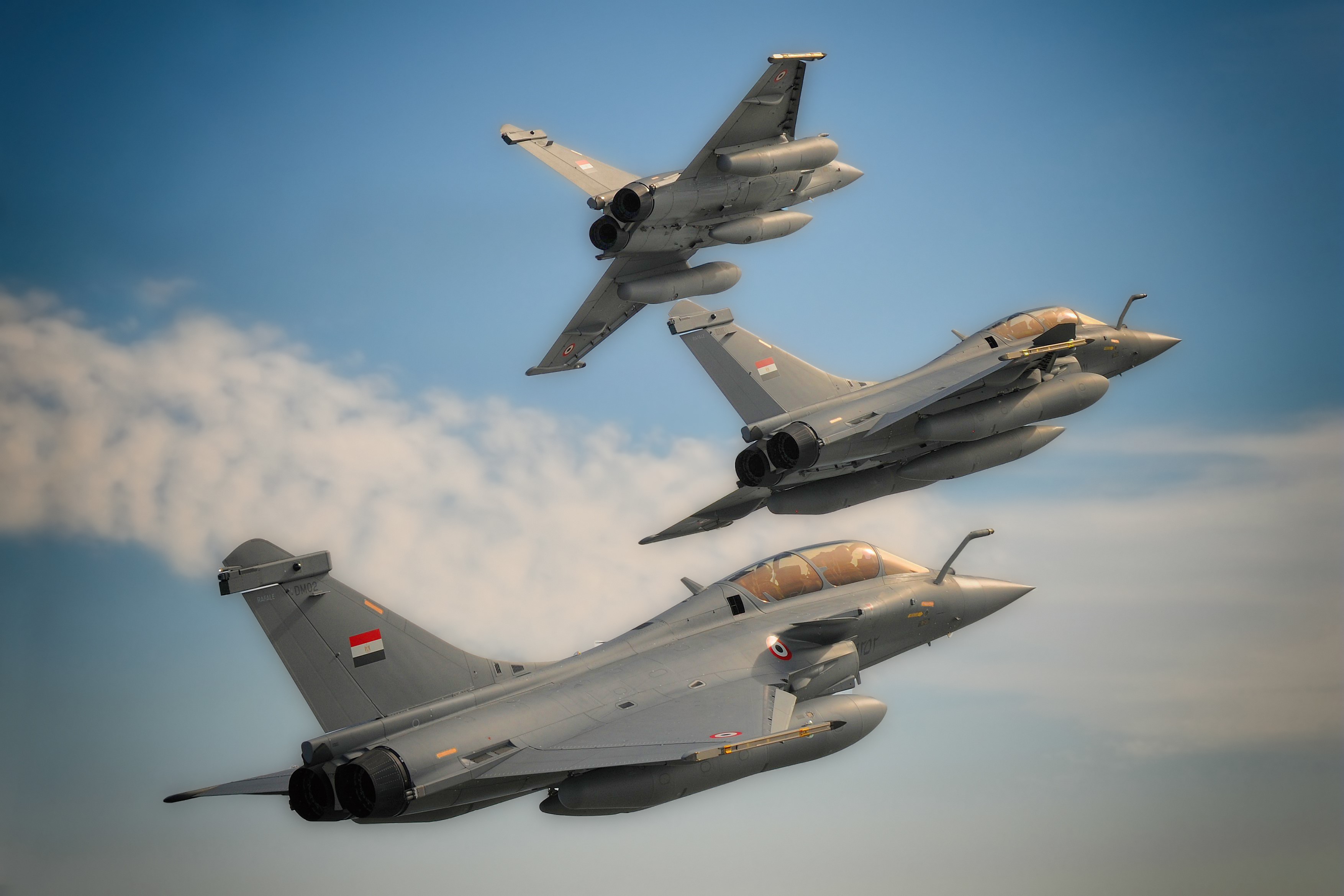 Three Egyptian Dassault Rafale fighter jets in flight HD Wallpaper