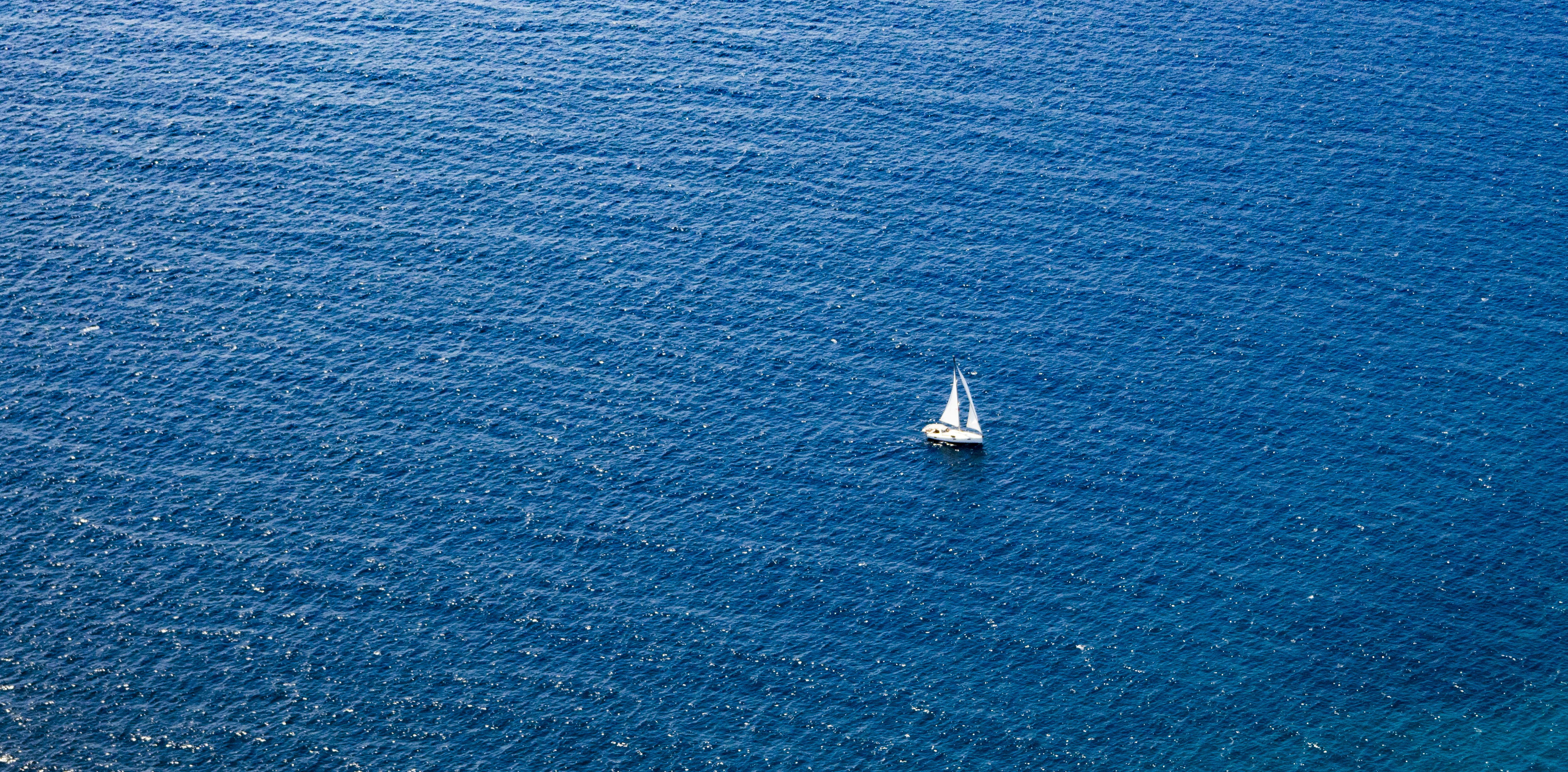 Sailboat on a windy blue sea HD Wallpaper