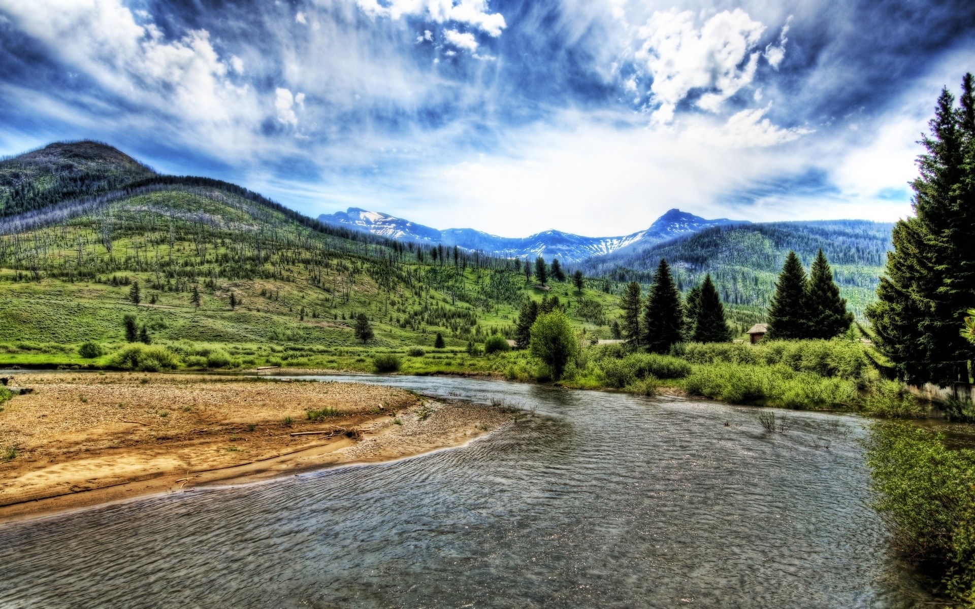 River flowing through a valley with mountains and trees HD Wallpaper