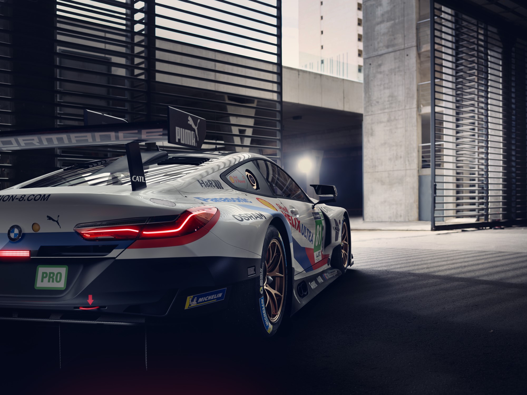 BMW M8 GTE race car with Puma and Michelin logos HD Wallpaper