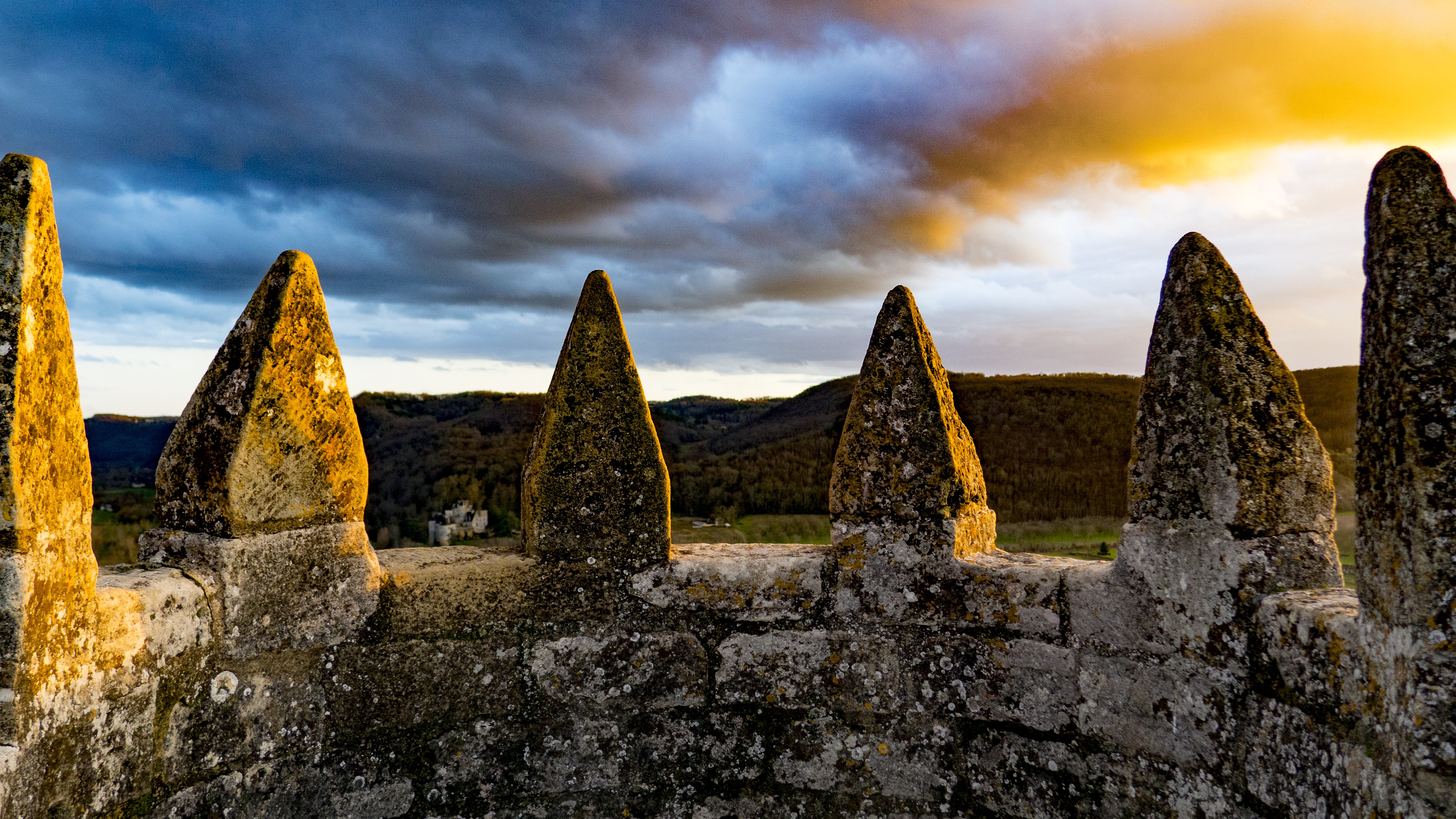 Castle wall with crenellations at sunset HD Wallpaper