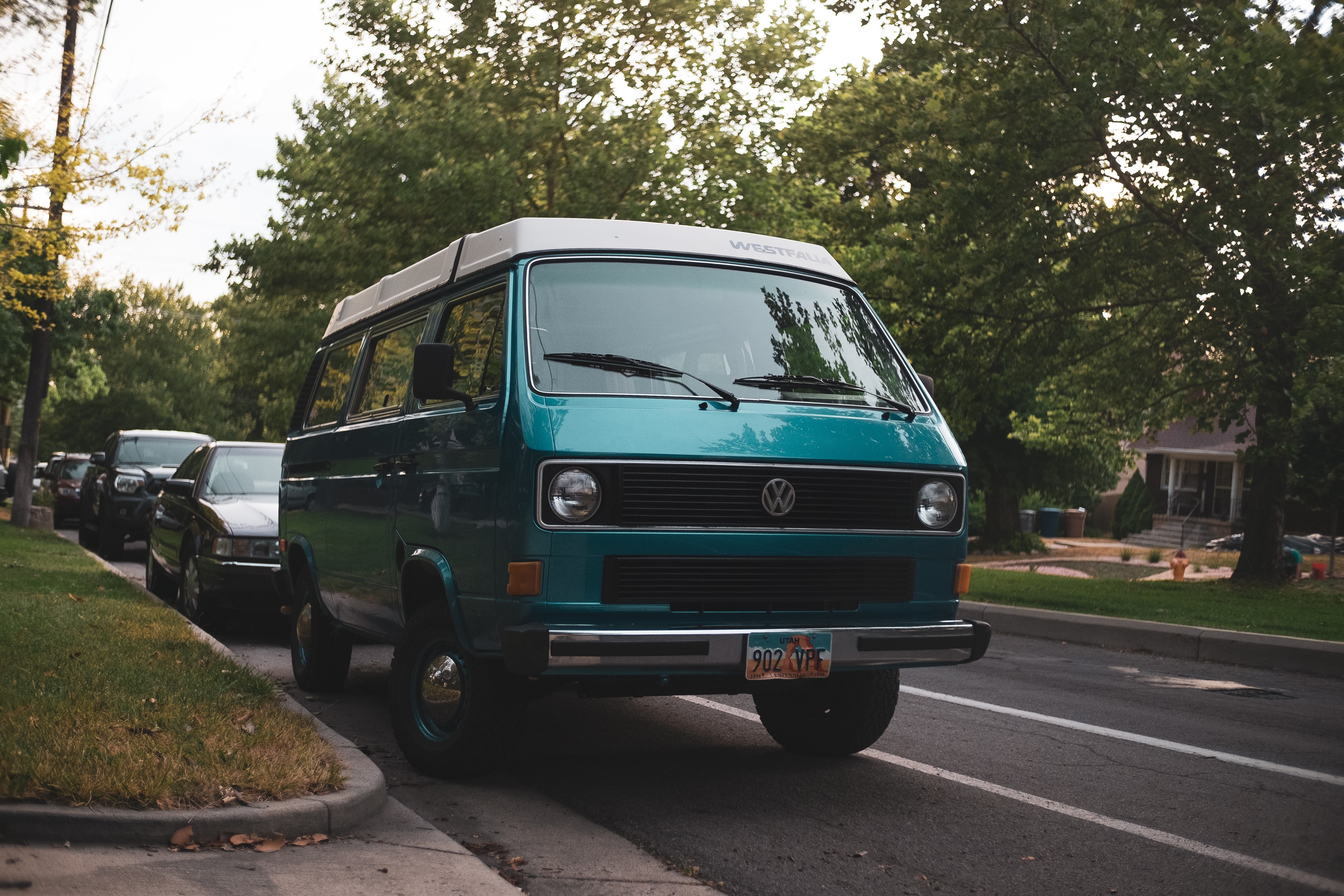 Teal Volkswagen Transporter Westfalia parked on a street HD Wallpaper