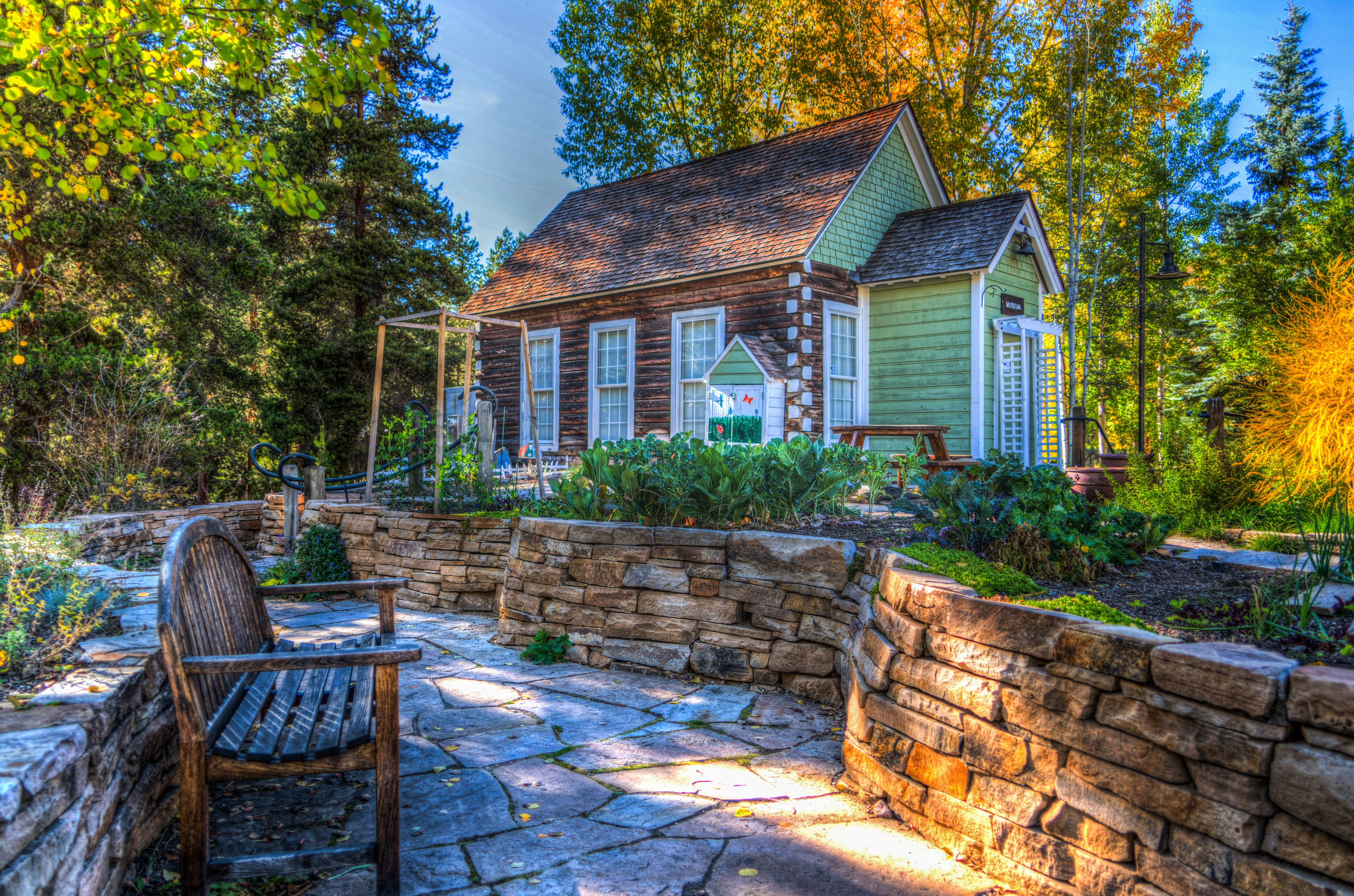 Autumn garden with a small house and stone path HD Wallpaper