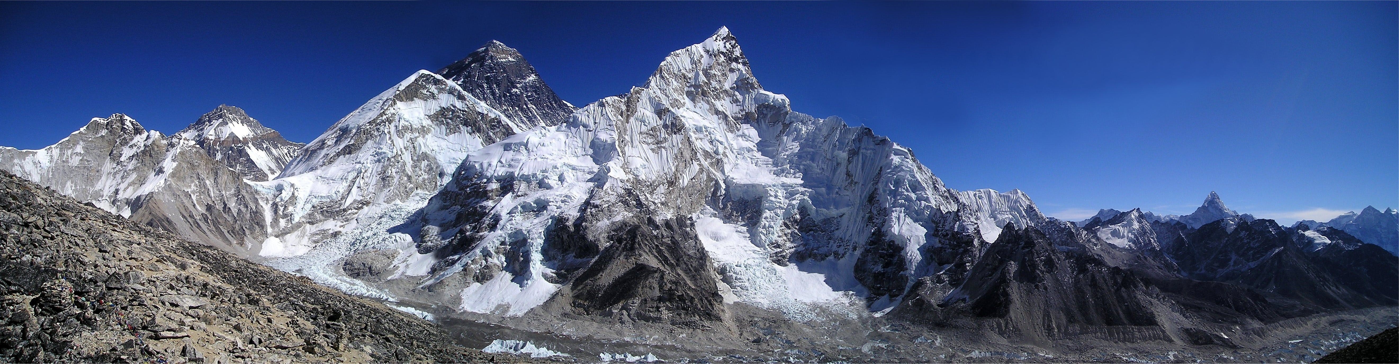 Panorama of snowy mountains under a blue sky HD Wallpaper