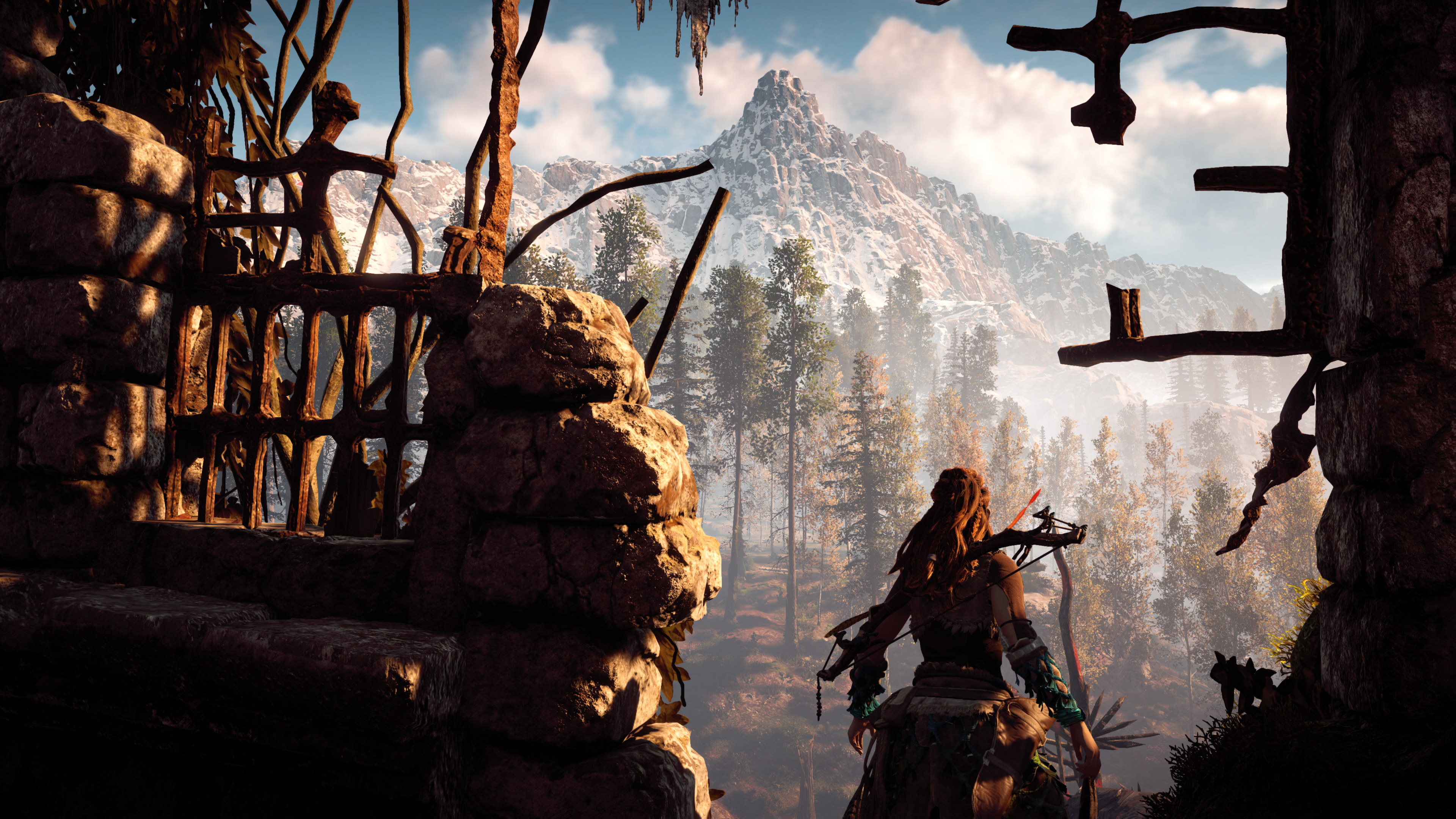 Aloy from Horizon Zero Dawn in a ruin with mountains HD Wallpaper