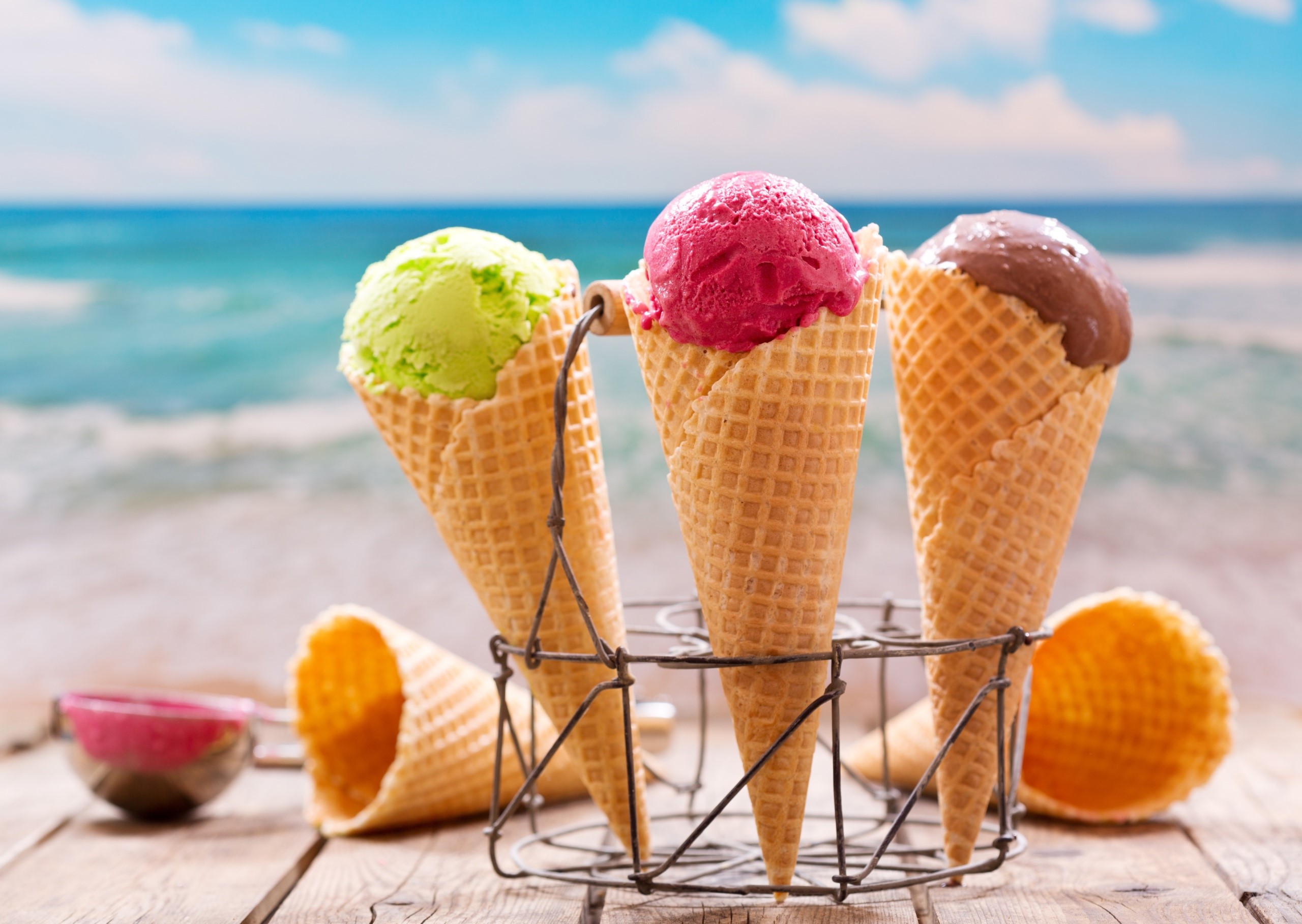 Three ice cream cones on a beach HD Wallpaper