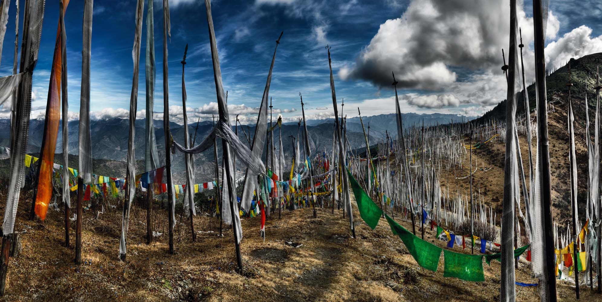 Prayer flags on a mountain ridge in Bhutan HD Wallpaper